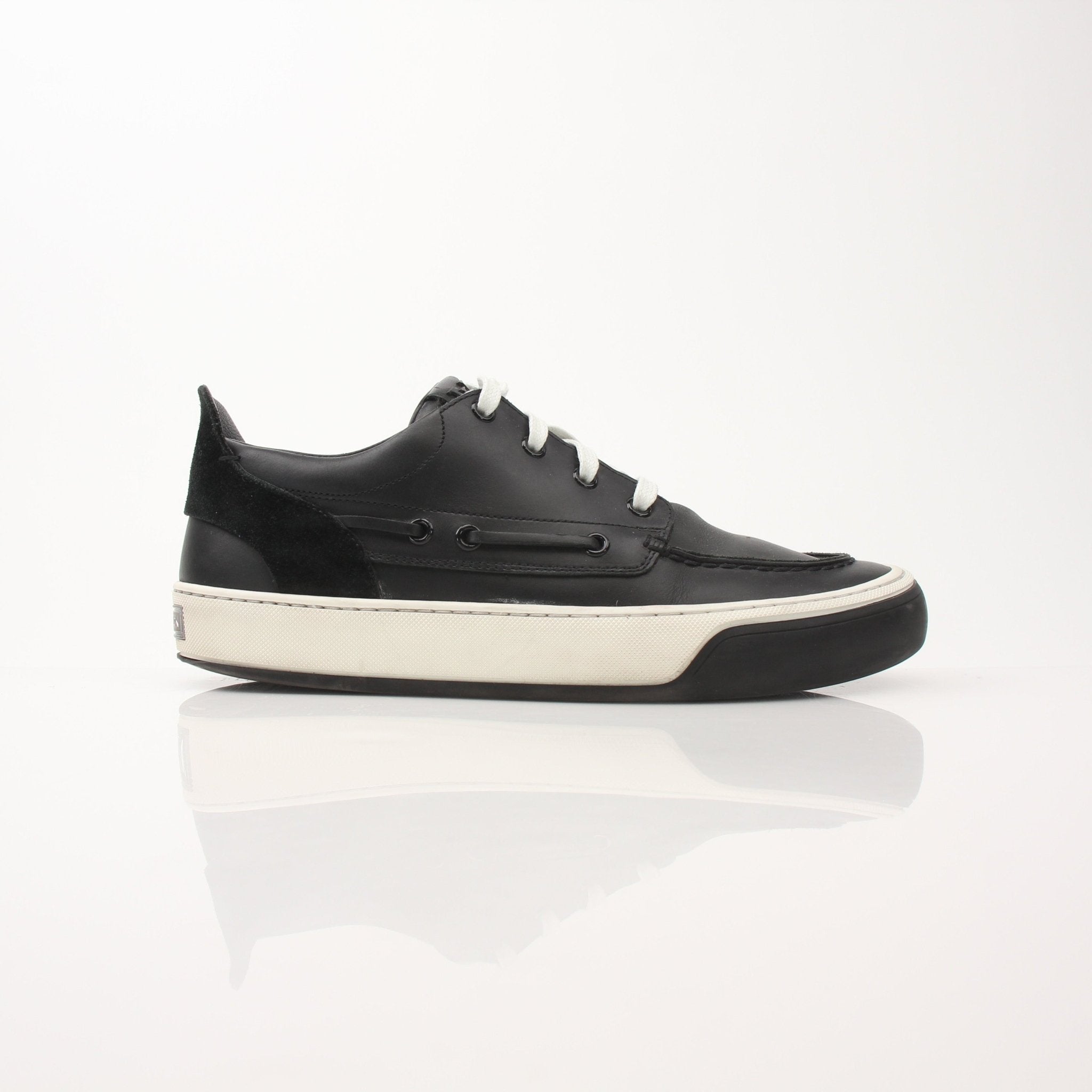 Louis Vuitton Damier Low Top Sneakers featuring classic checkerboard design and white rubber sole, by Gold & Beyond.
