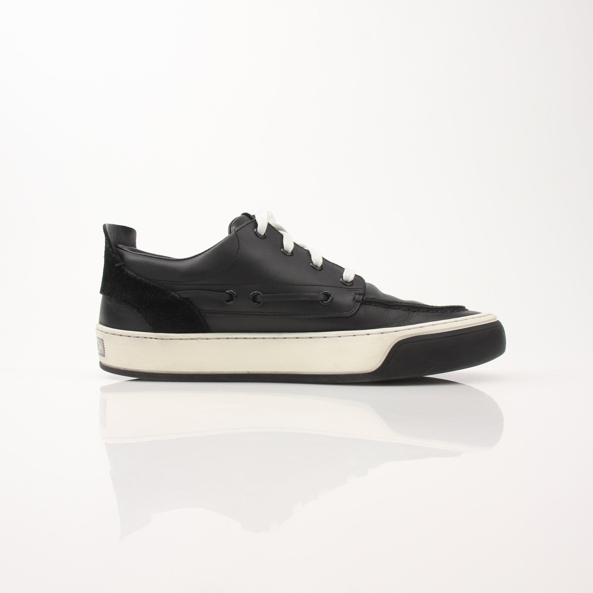 Gold & Beyond Louis Vuitton Damier low top sneakers with checkered pattern, white rubber soles, and stylish design.