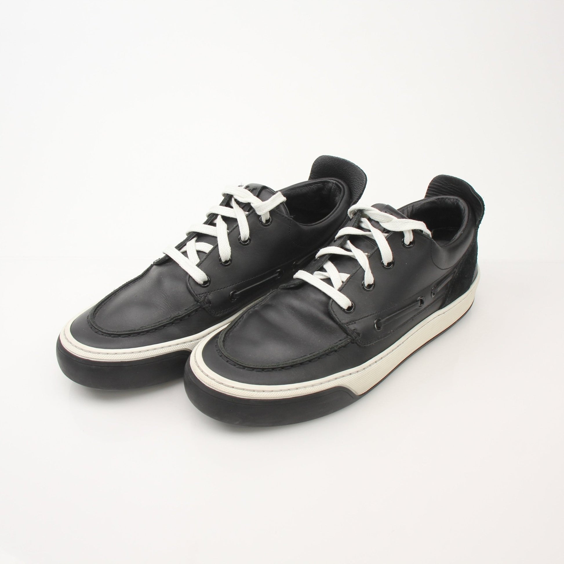 Gold & Beyond Louis Vuitton Damier low top sneakers with checkerboard pattern, white rubber soles, and lace-up design.
