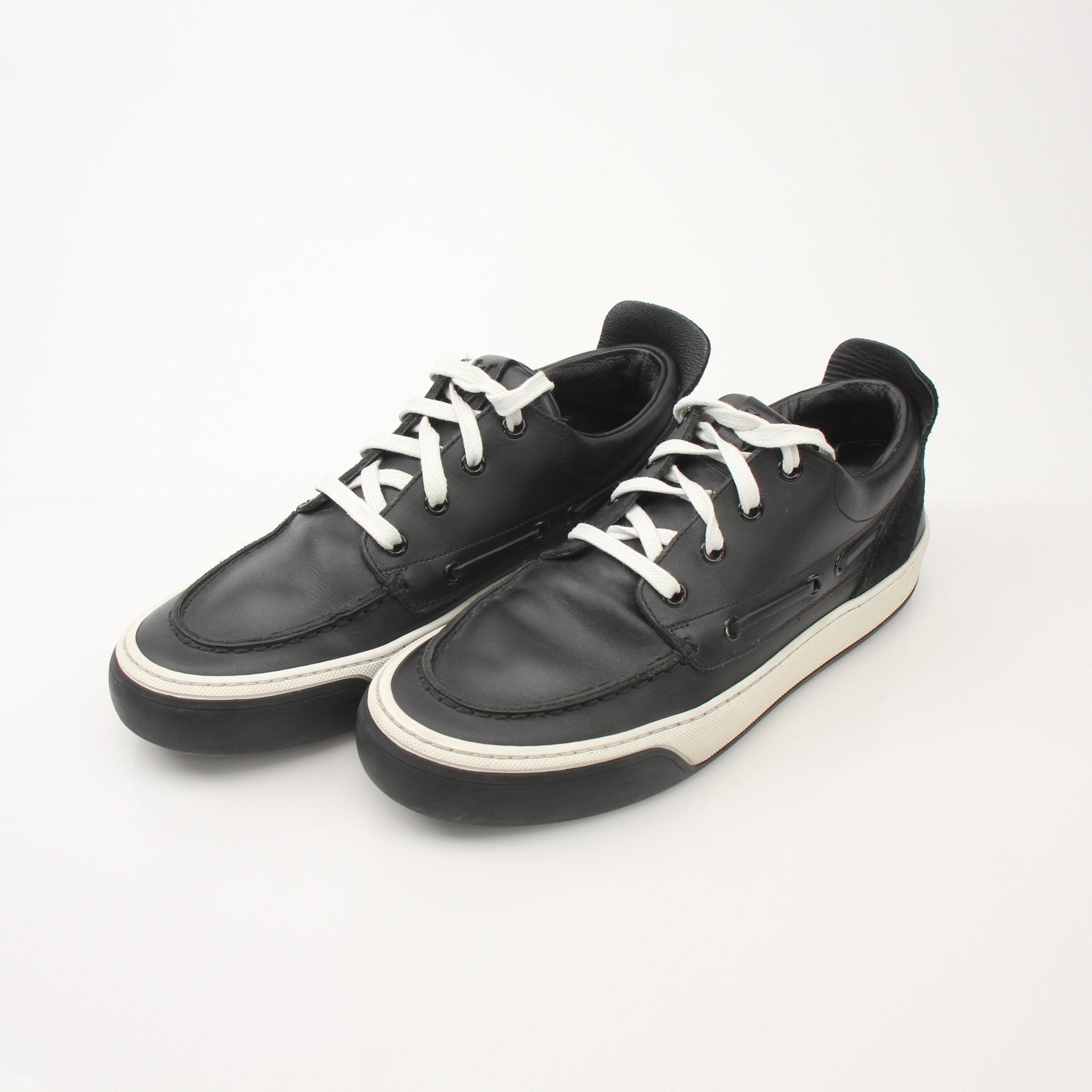 Gold & Beyond Louis Vuitton Damier low top sneakers with checkerboard pattern, white rubber soles, and lace-up design.