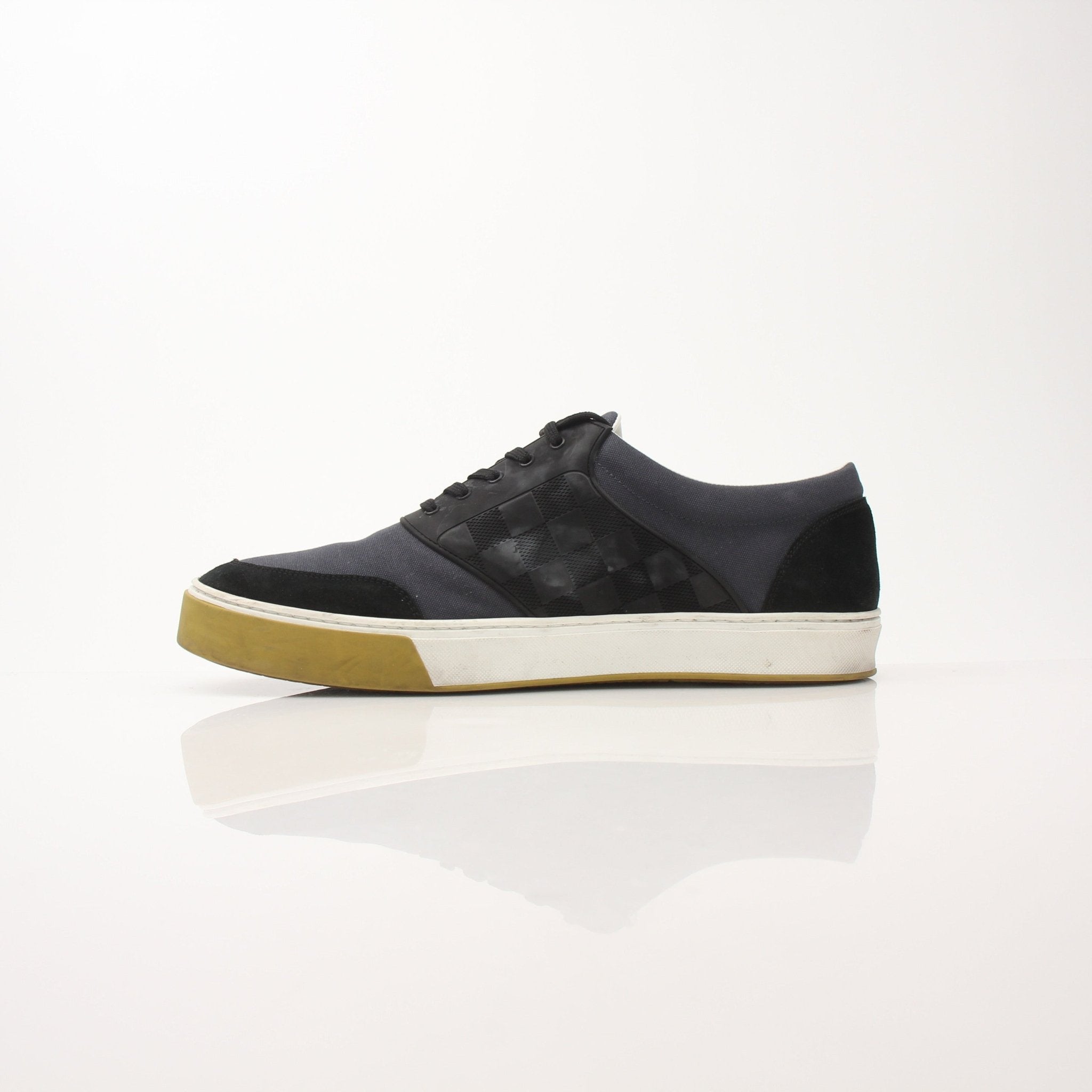 Louis Vuitton Pinball Sneakers in black and white with gold accents, featuring a stylish, modern shoe design from Gold & Beyond.