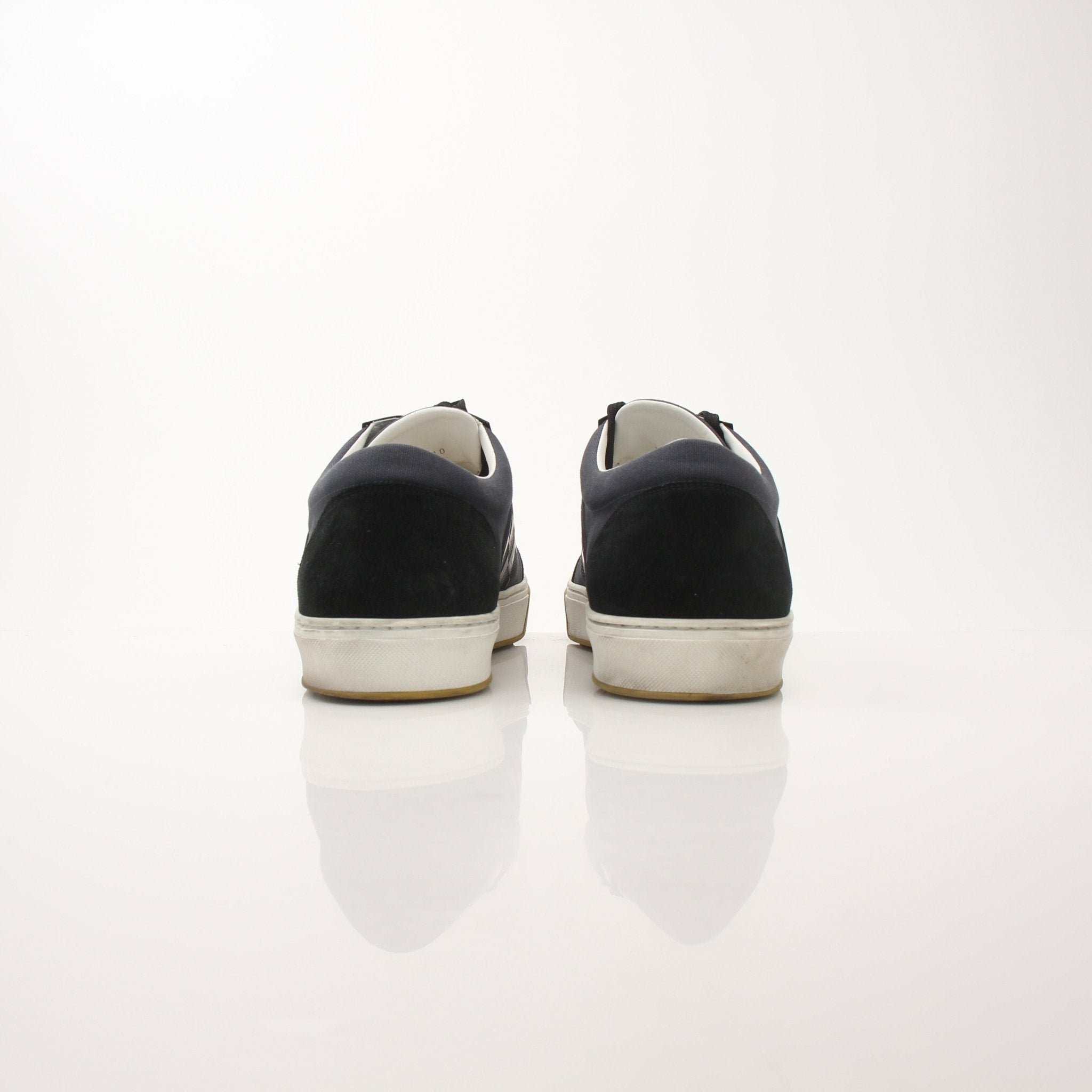 Louis Vuitton Pinball Sneakers in black and white with logo details, stylish shoes by Gold & Beyond.
