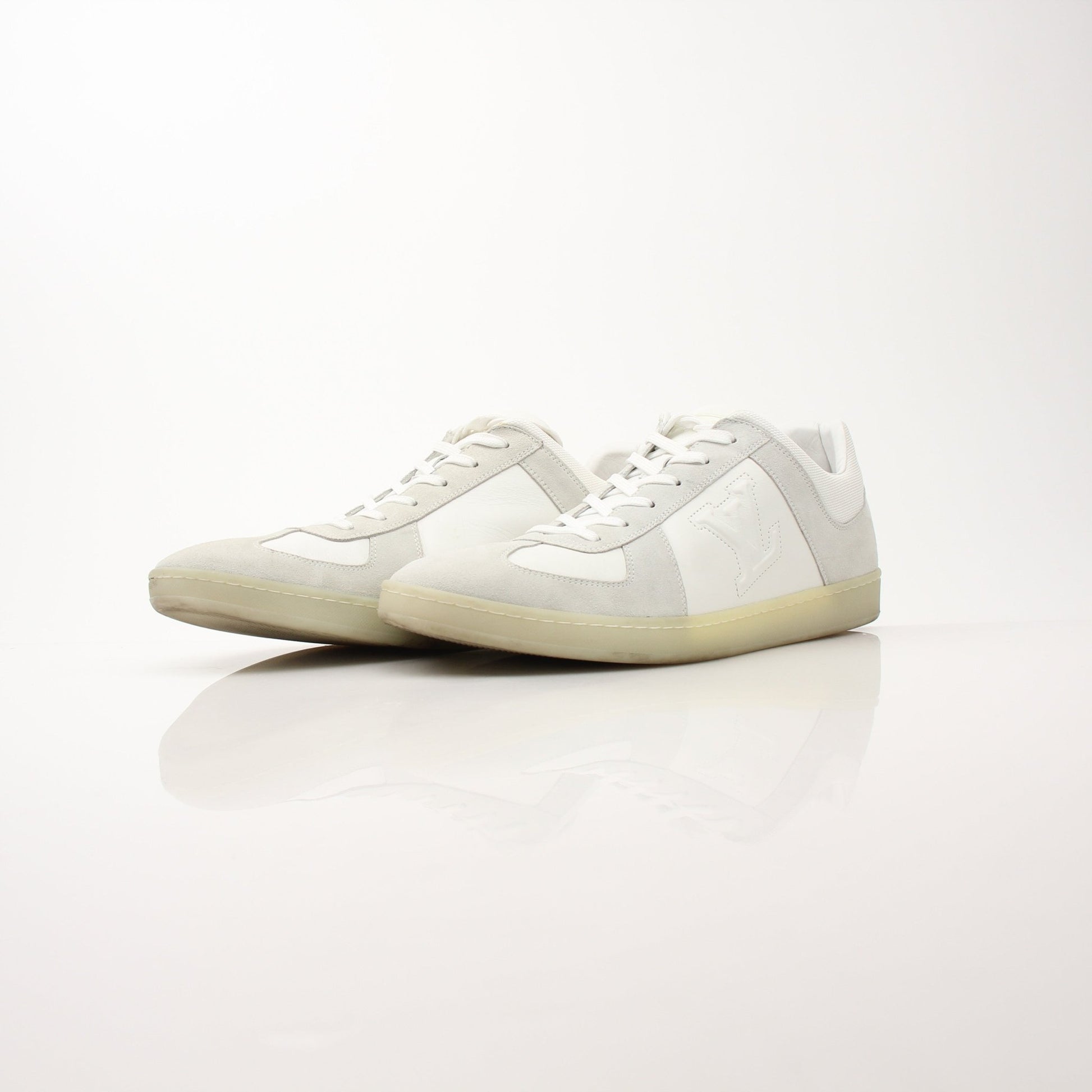 White Louis Vuitton low top sneakers by Gold & Beyond, featuring stylish casual shoes with a sleek design and comfortable fit.