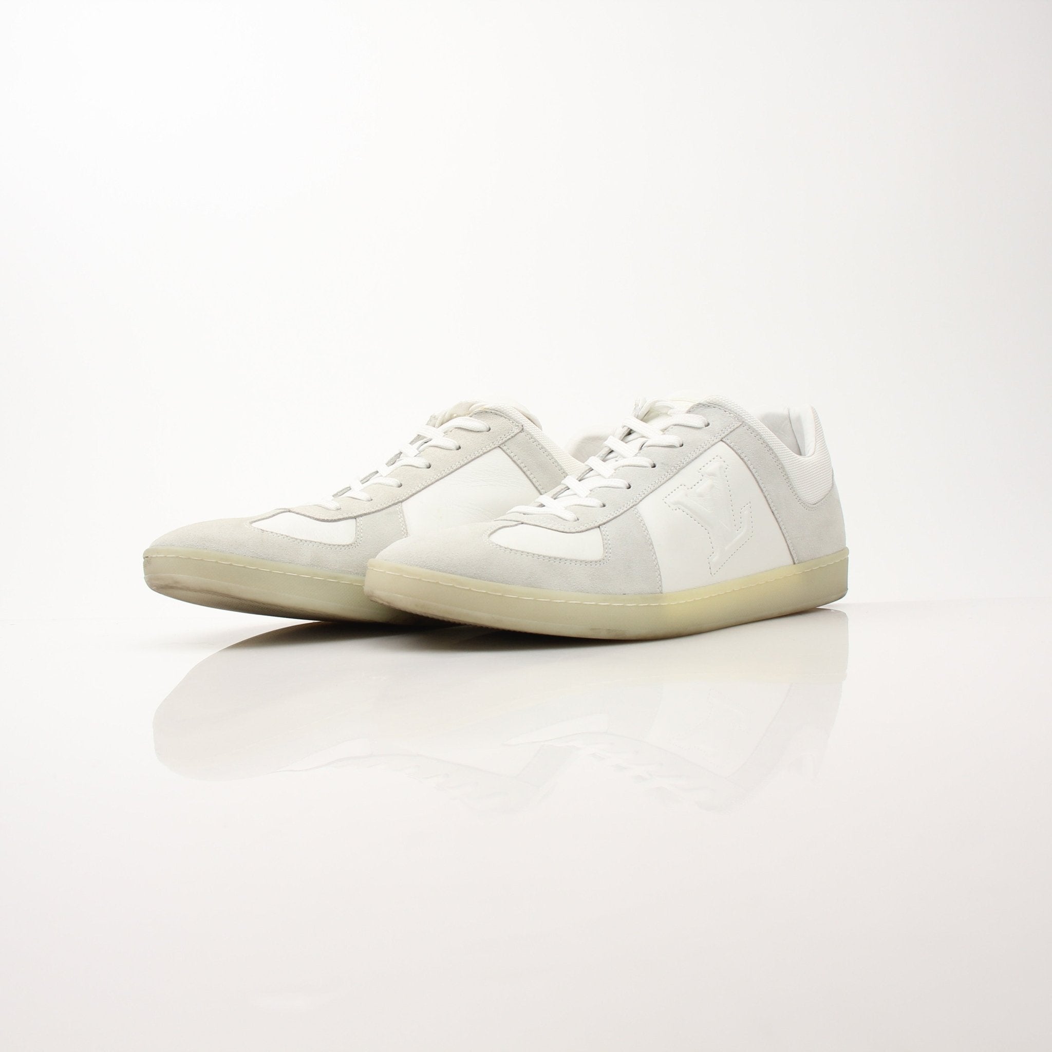 White Louis Vuitton low top sneakers by Gold & Beyond, featuring stylish casual shoes with a sleek design and comfortable fit.