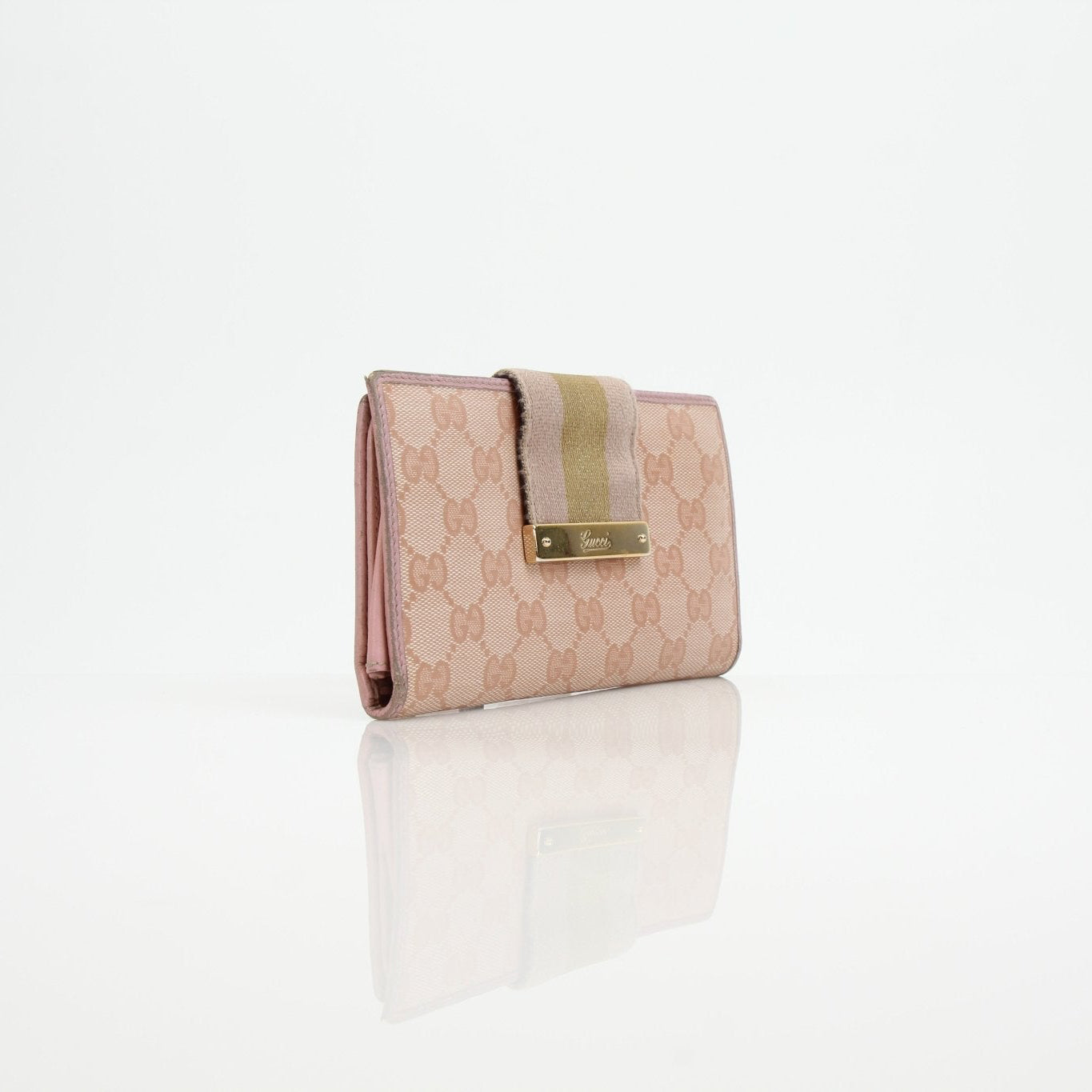 Pink Gucci GG Continental Wallet by Gold & Beyond, featuring classic monogram pattern and gold-tone accents.