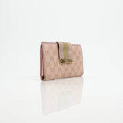 Pink Gucci GG Continental Wallet by Gold & Beyond, featuring classic monogram pattern and gold-tone accents.