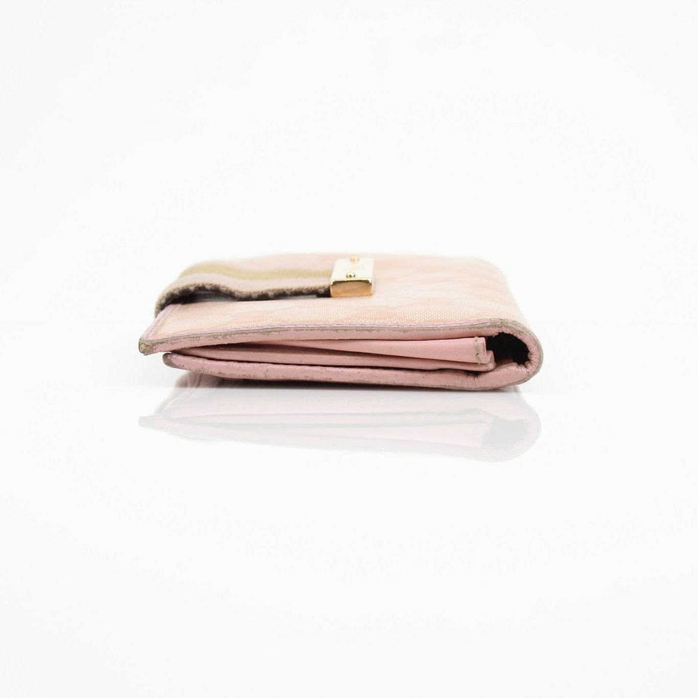 Gucci pink GG Continental wallet with gold accents, showcasing its stylish leather exterior and classic design.