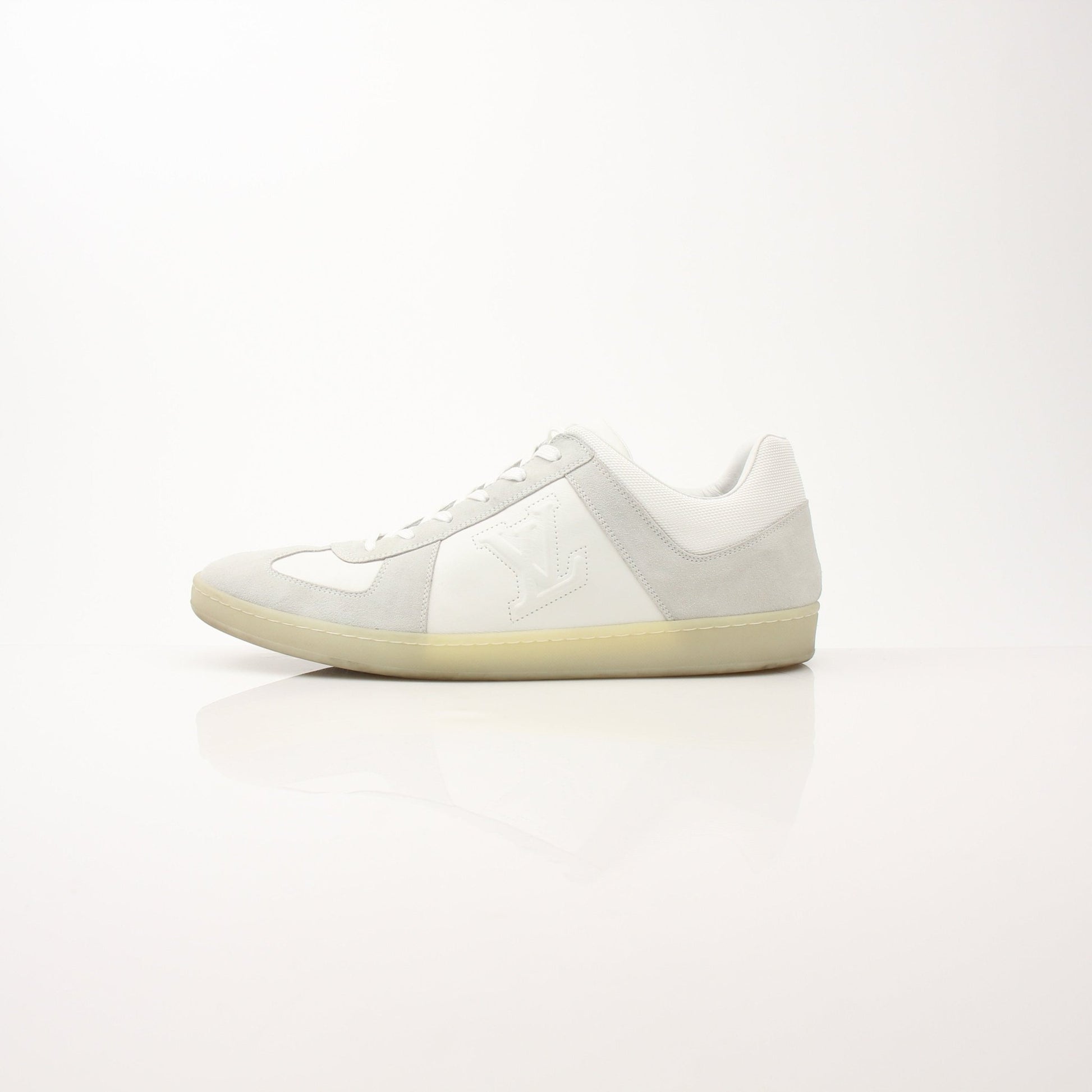 Louis Vuitton white low top sneakers with gold accents, casual shoes for everyday wear, by Gold & Beyond.