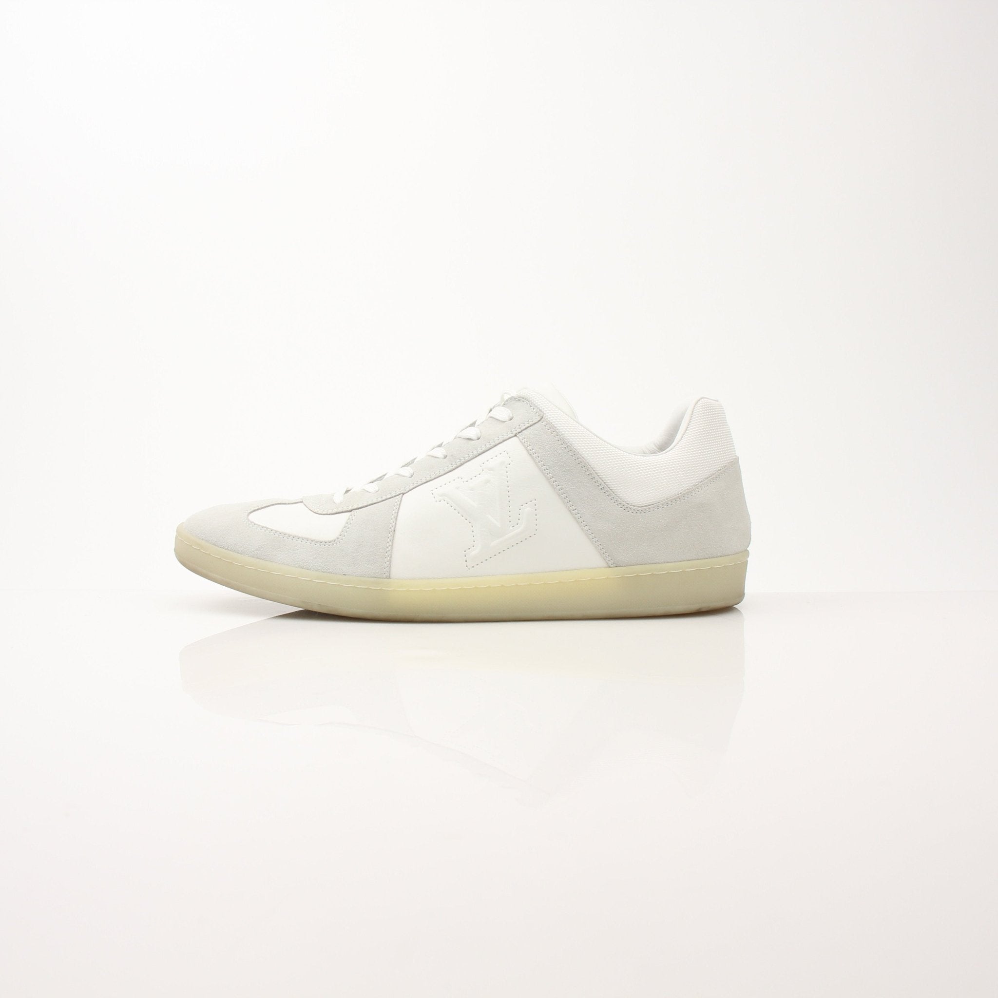 Louis Vuitton white low top sneakers with gold accents, casual shoes for everyday wear, by Gold & Beyond.