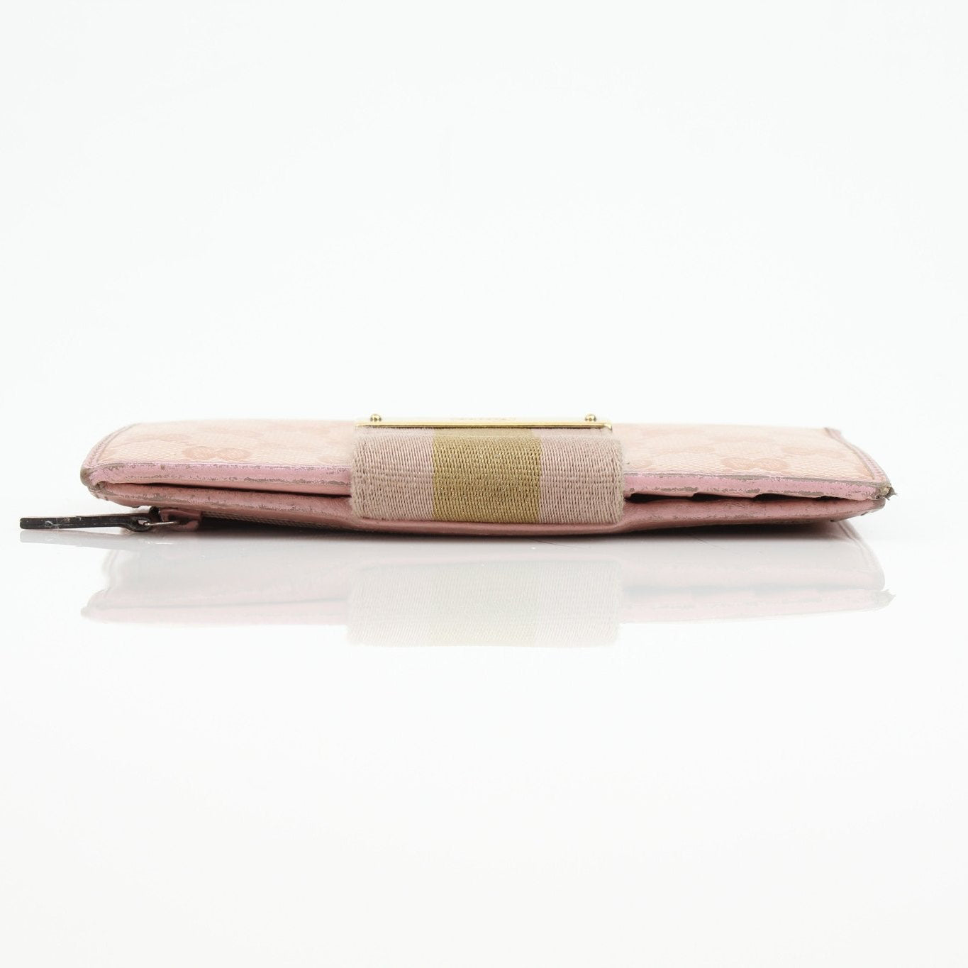 Gucci pink GG continental wallet with gold accents, featuring a sleek leather design and multiple card slots.