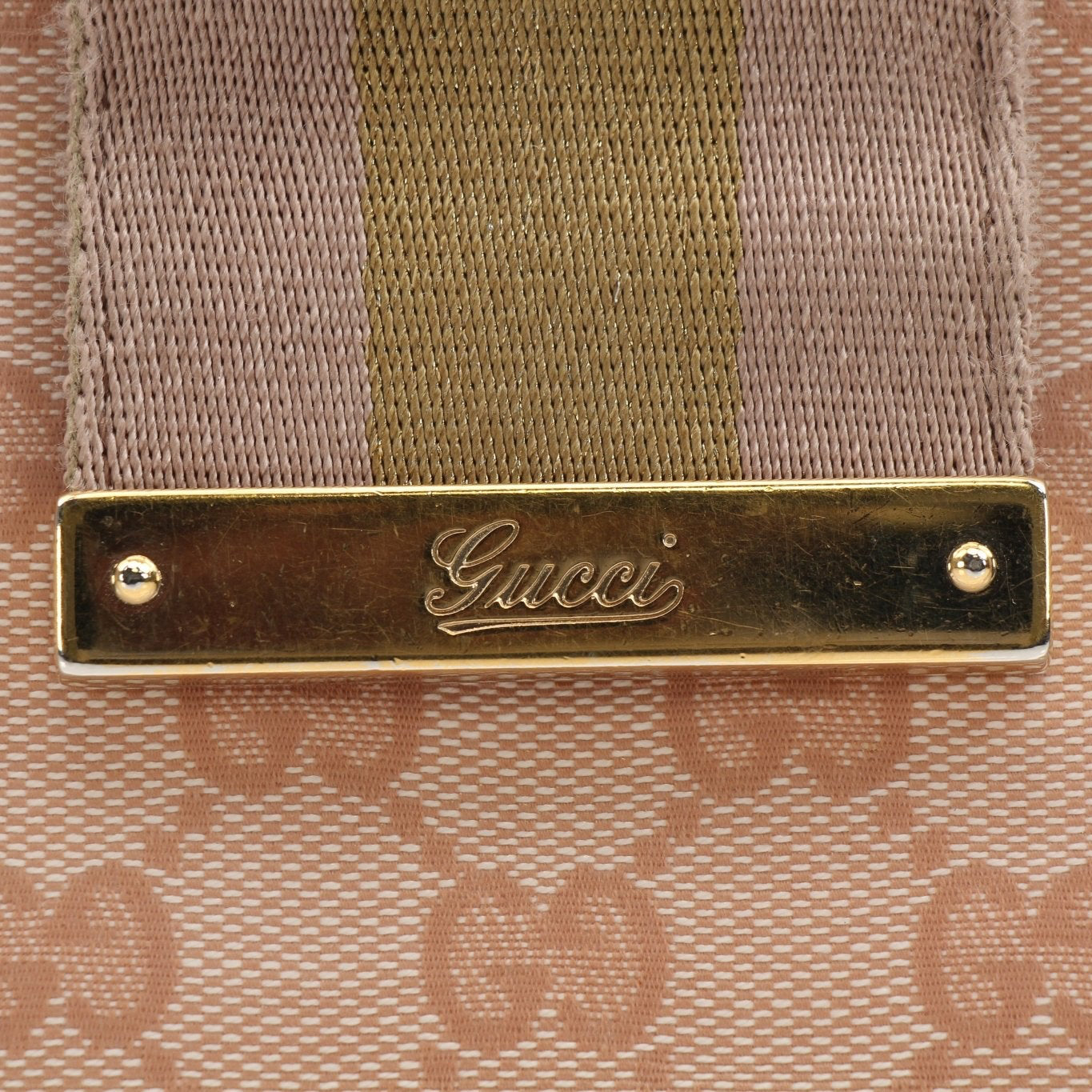 Gucci pink GG Continental wallet with gold accents, featuring a leather interior and signature monogram design.