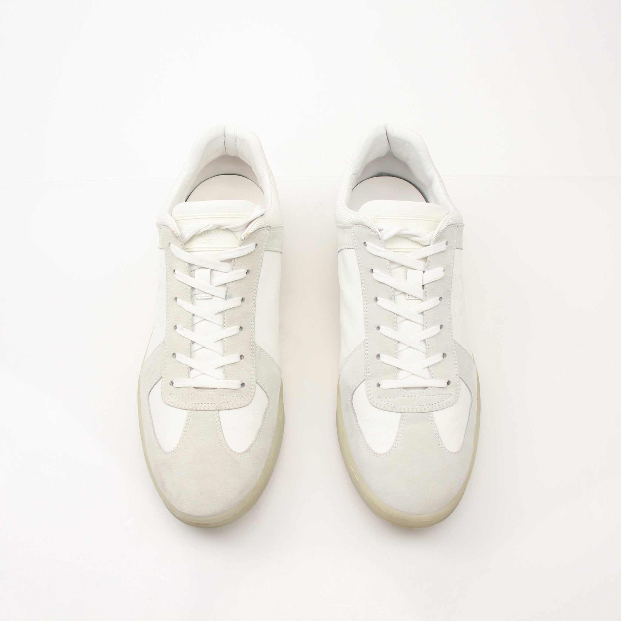 White Louis Vuitton low top sneakers by Gold & Beyond, featuring stylish design and comfortable shoes for casual wear.