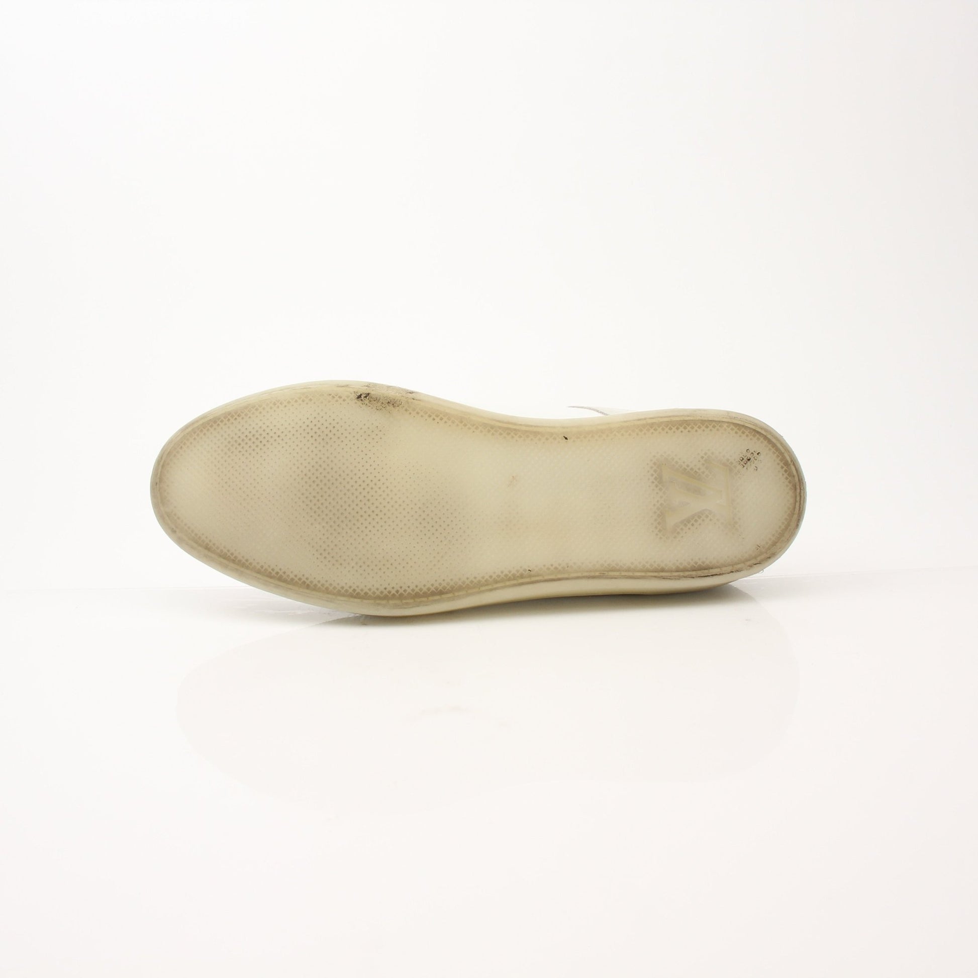 Louis Vuitton white low top sneakers by Gold & Beyond, featuring classic design and stylish laces on clean white shoes.