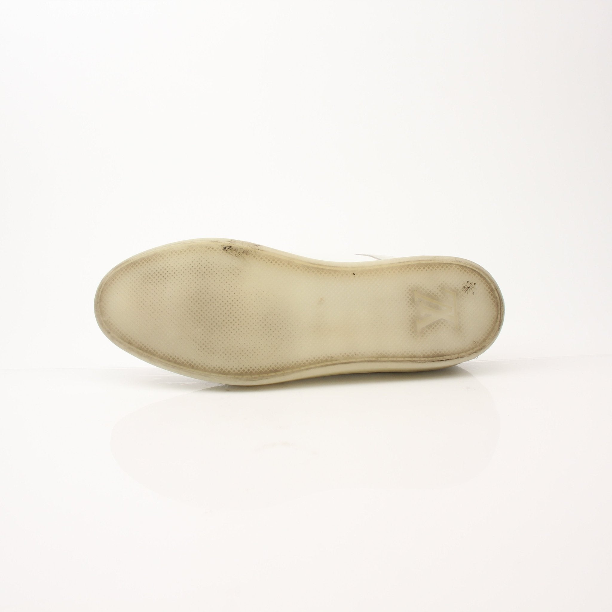 Louis Vuitton white low top sneakers by Gold & Beyond, featuring classic design and stylish laces on clean white shoes.