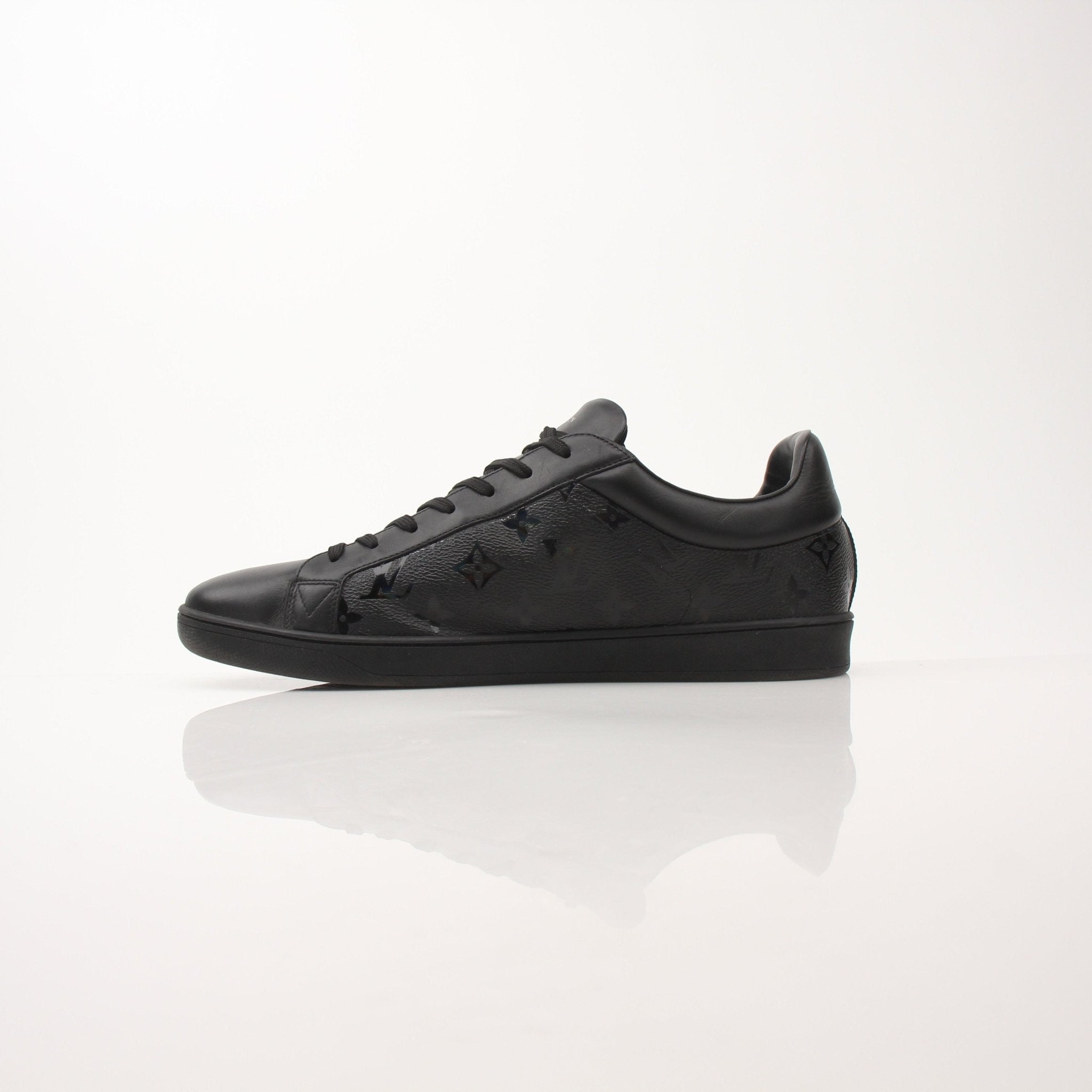 Pair of Louis Vuitton Luxembourg Sneakers by Gold & Beyond, showcasing stylish shoes with detailed design and branding.