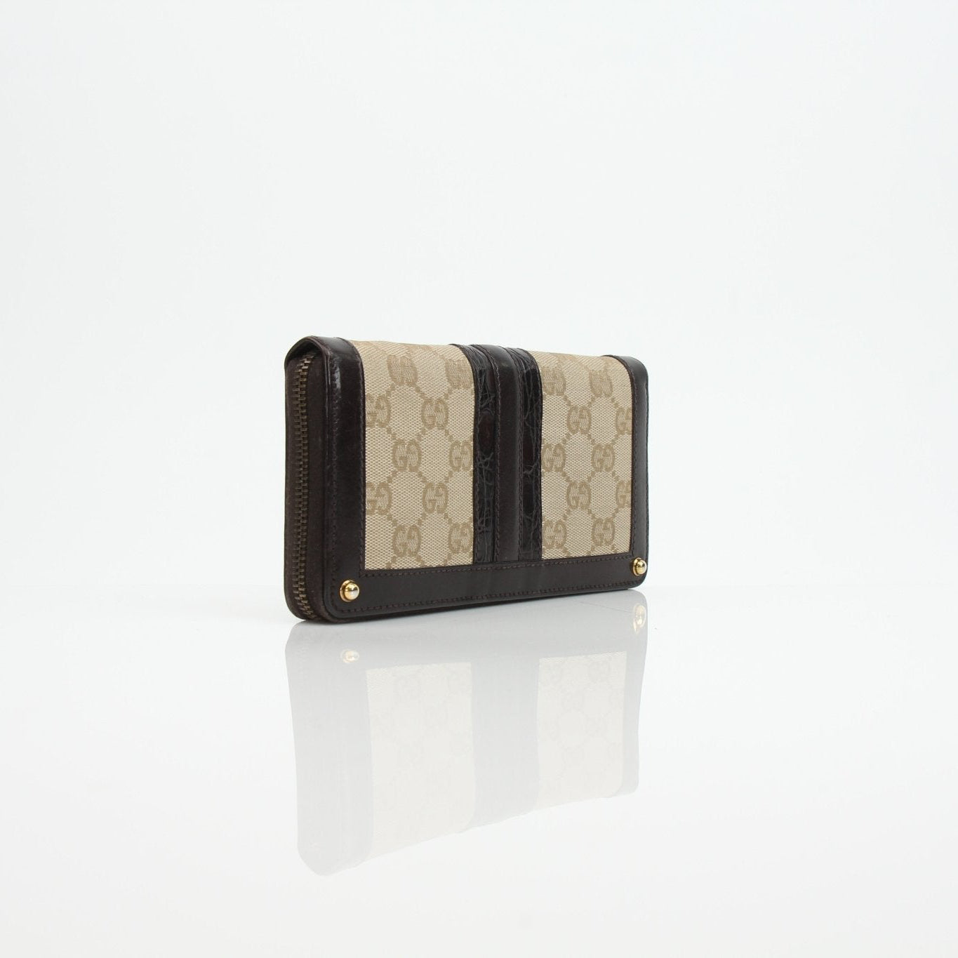 Gucci crocodile canvas wallet with gold accents, featuring multiple card slots and a sleek design.