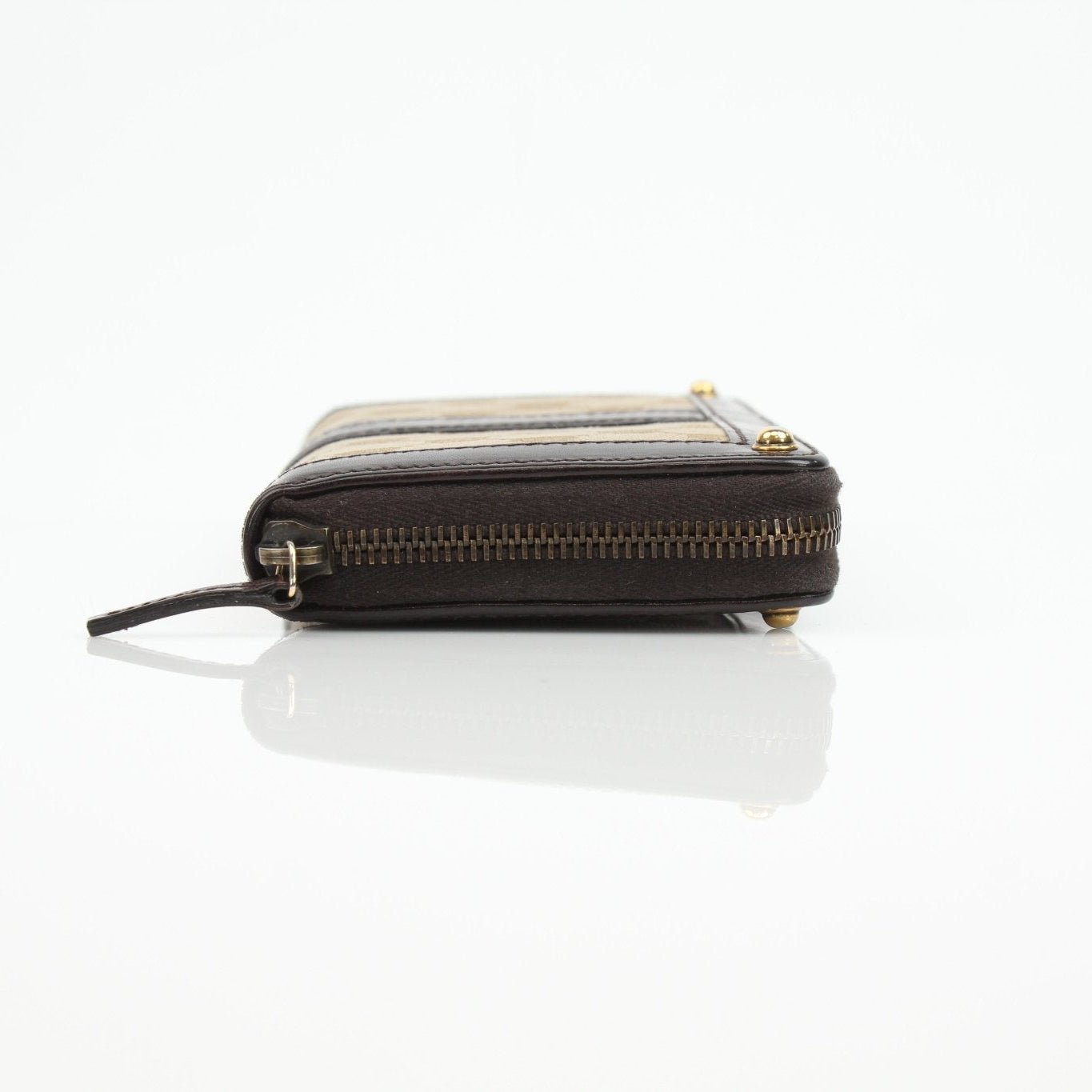 Gucci crocodile canvas wallet with gold accents, featuring a sleek, compact design and multiple card slots.