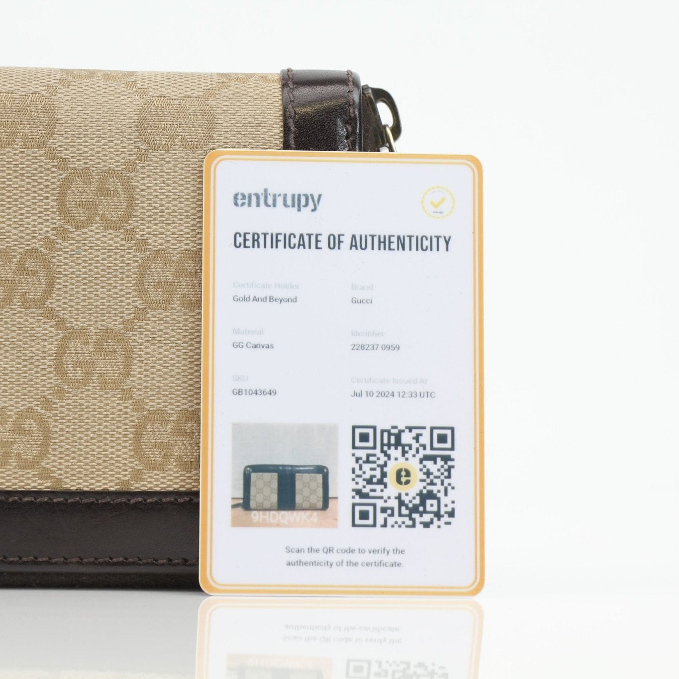 Gucci crocodile canvas wallet with gold accents, featuring a sleek design and multiple card slots, by Gold & Beyond.