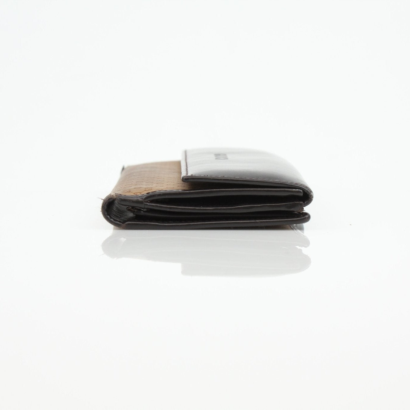 Gucci Guccissima canvas wallet by Gold & Beyond with signature monogram pattern and multiple card slots on a white background.