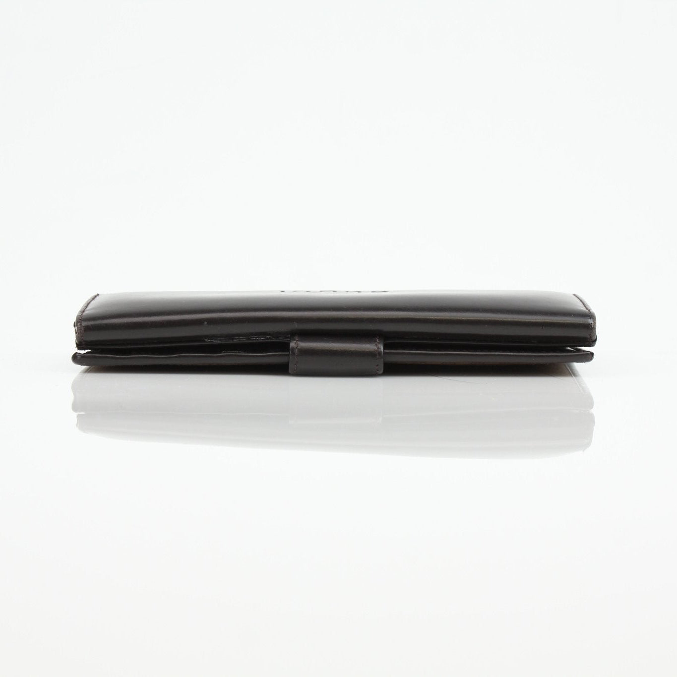 Gucci Guccissima canvas wallet with gold accents, featuring signature monogram pattern and multiple card slots.