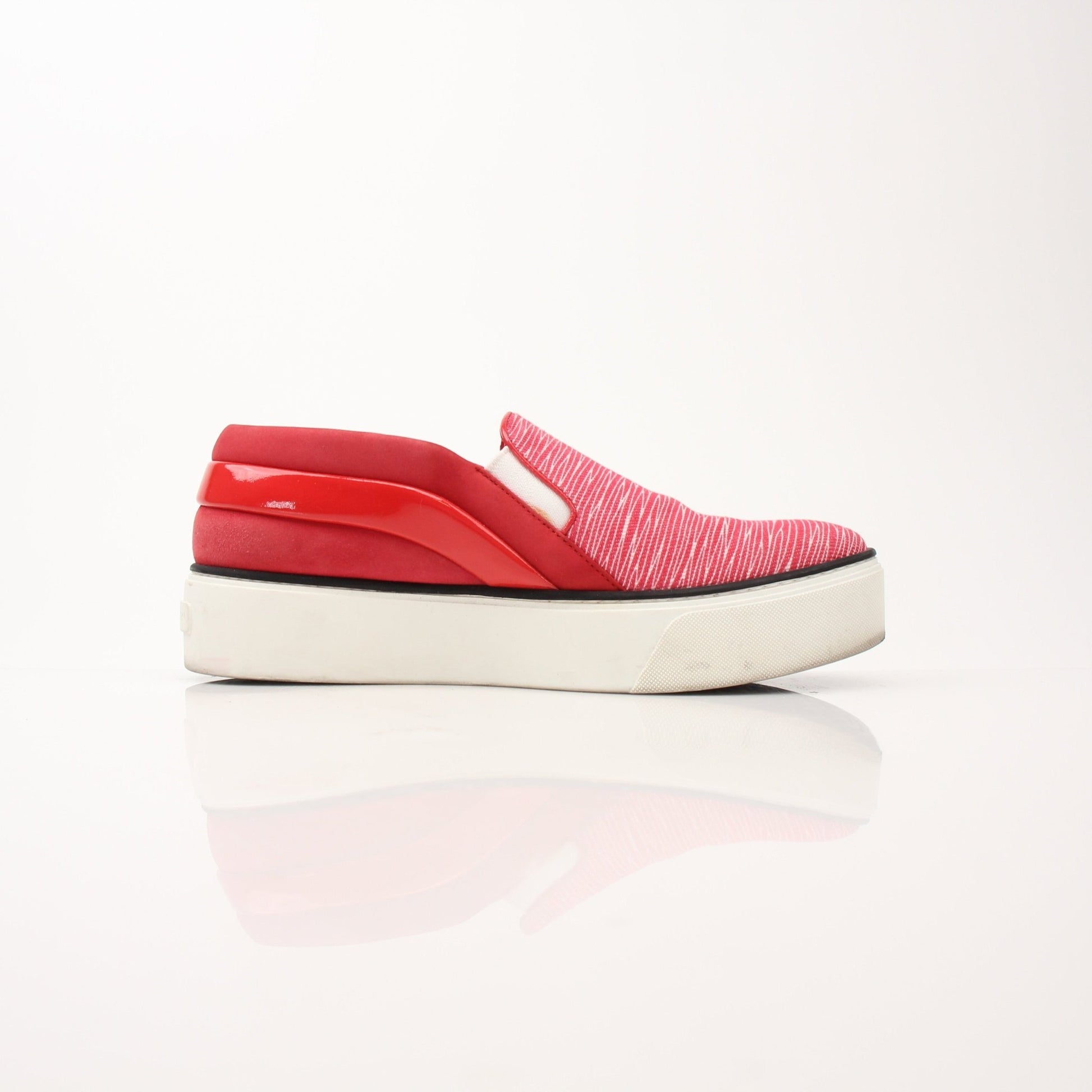 Red Louis Vuitton slip-on sneakers by Gold & Beyond, featuring sleek design and comfortable fit for casual wear.