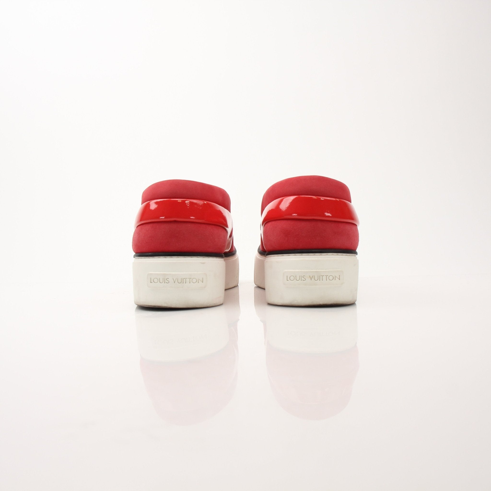 Louis Vuitton red slip-on sneakers by Gold & Beyond, featuring stylish design and comfortable casual footwear.