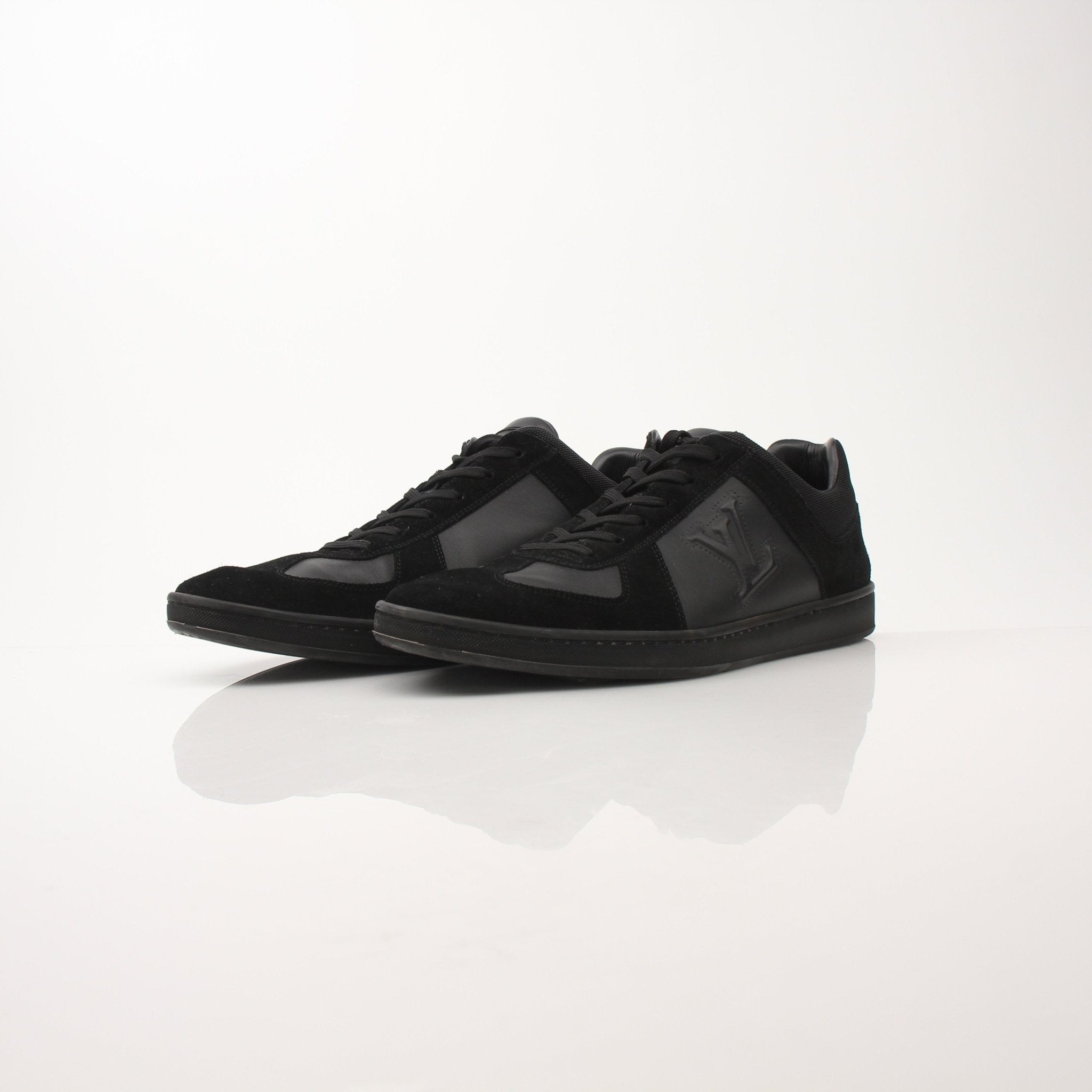 Black Louis Vuitton low top sneakers by Gold & Beyond, showcasing sleek leather uppers and stylish design details.
