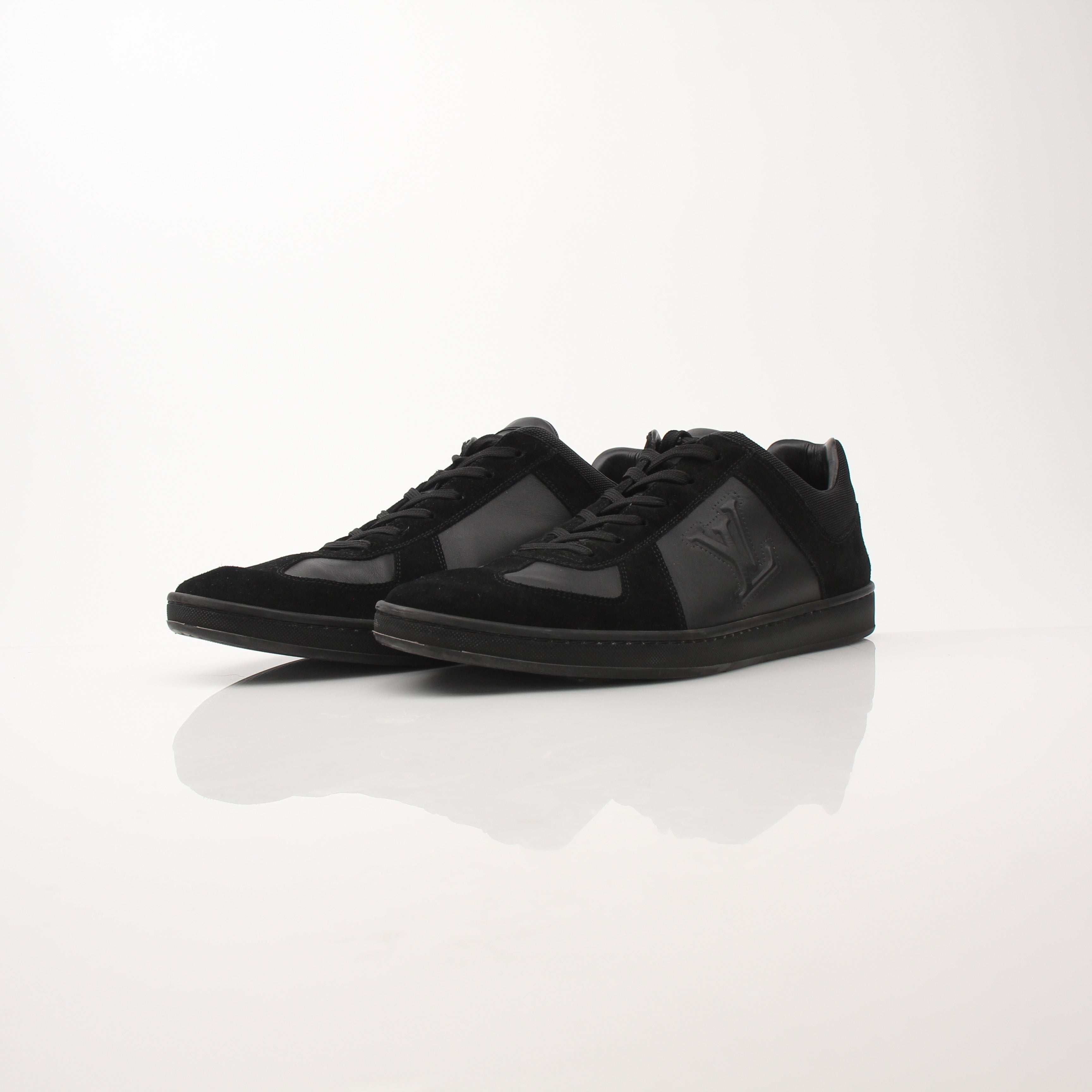 Black Louis Vuitton low top sneakers by Gold & Beyond, showcasing sleek leather uppers and stylish design details.