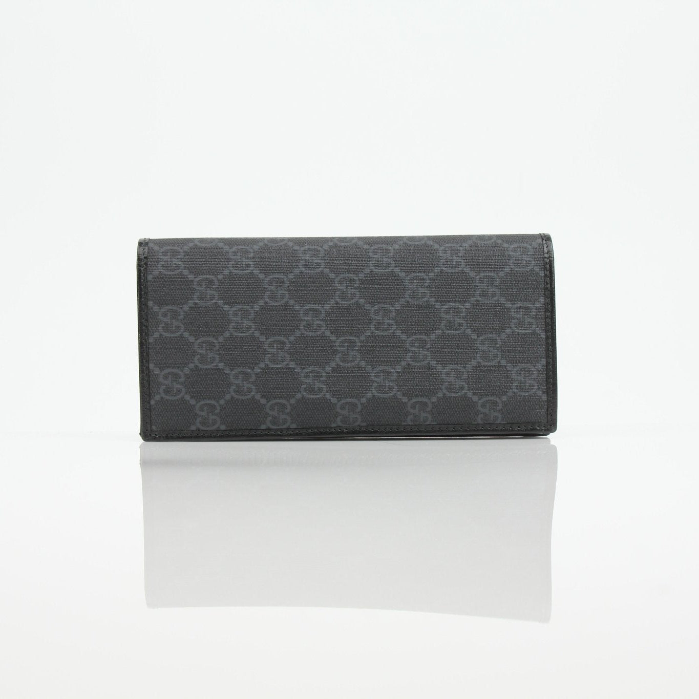 Gucci GG Supreme black wallet with gold accents, slim design, and multiple card slots, made by Gold & Beyond.