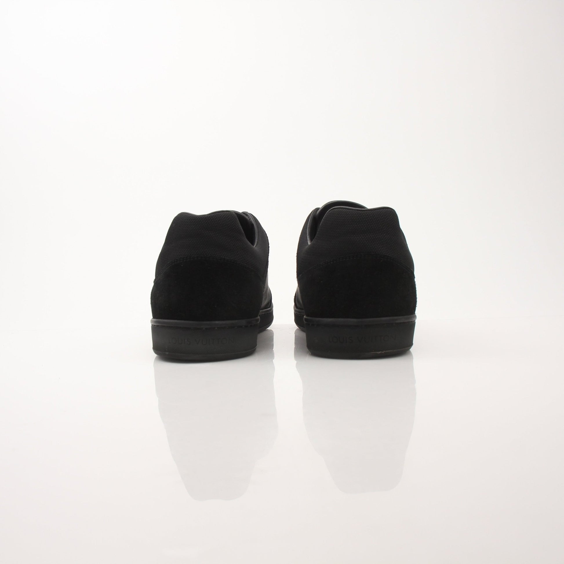 Louis Vuitton black low top sneakers by Gold & Beyond, featuring sleek design and classic style for casual wear.