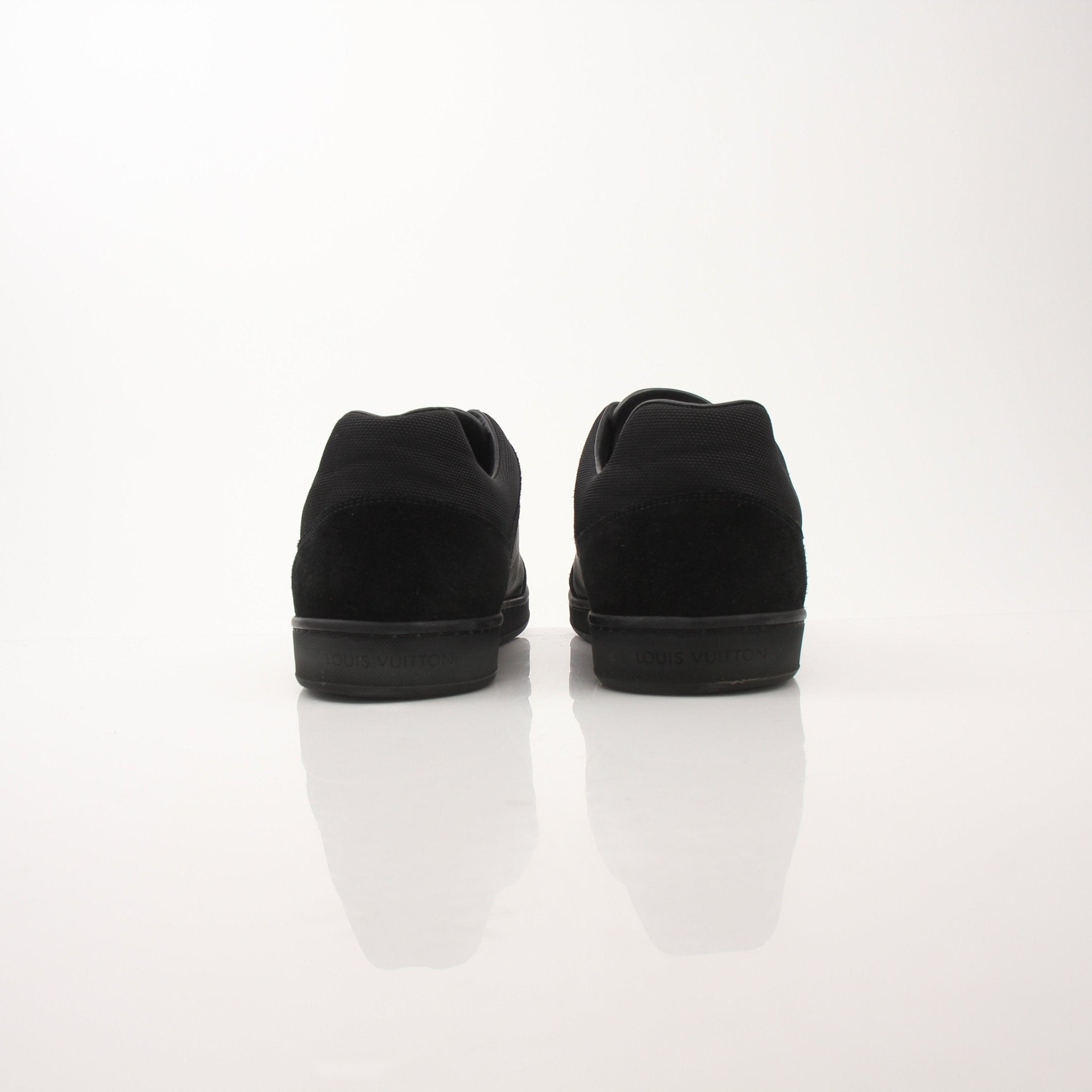 Louis Vuitton black low top sneakers by Gold & Beyond, featuring sleek design and classic style for casual wear.