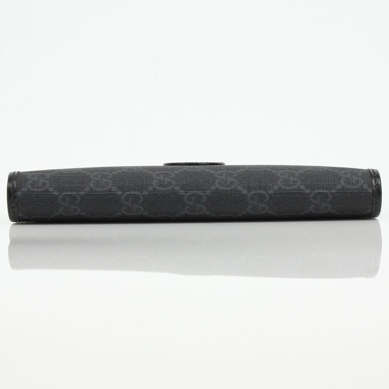 Gucci GG Supreme black wallet with gold accents, featuring a sleek design and multiple card slots, by Gold & Beyond.