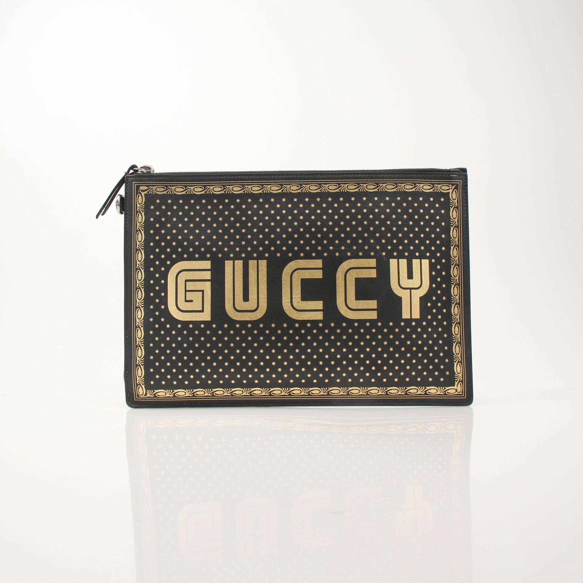 Gucci x SEGA black clutch handbag by Gold & Beyond featuring a sleek design and logo detail for stylish accessories.