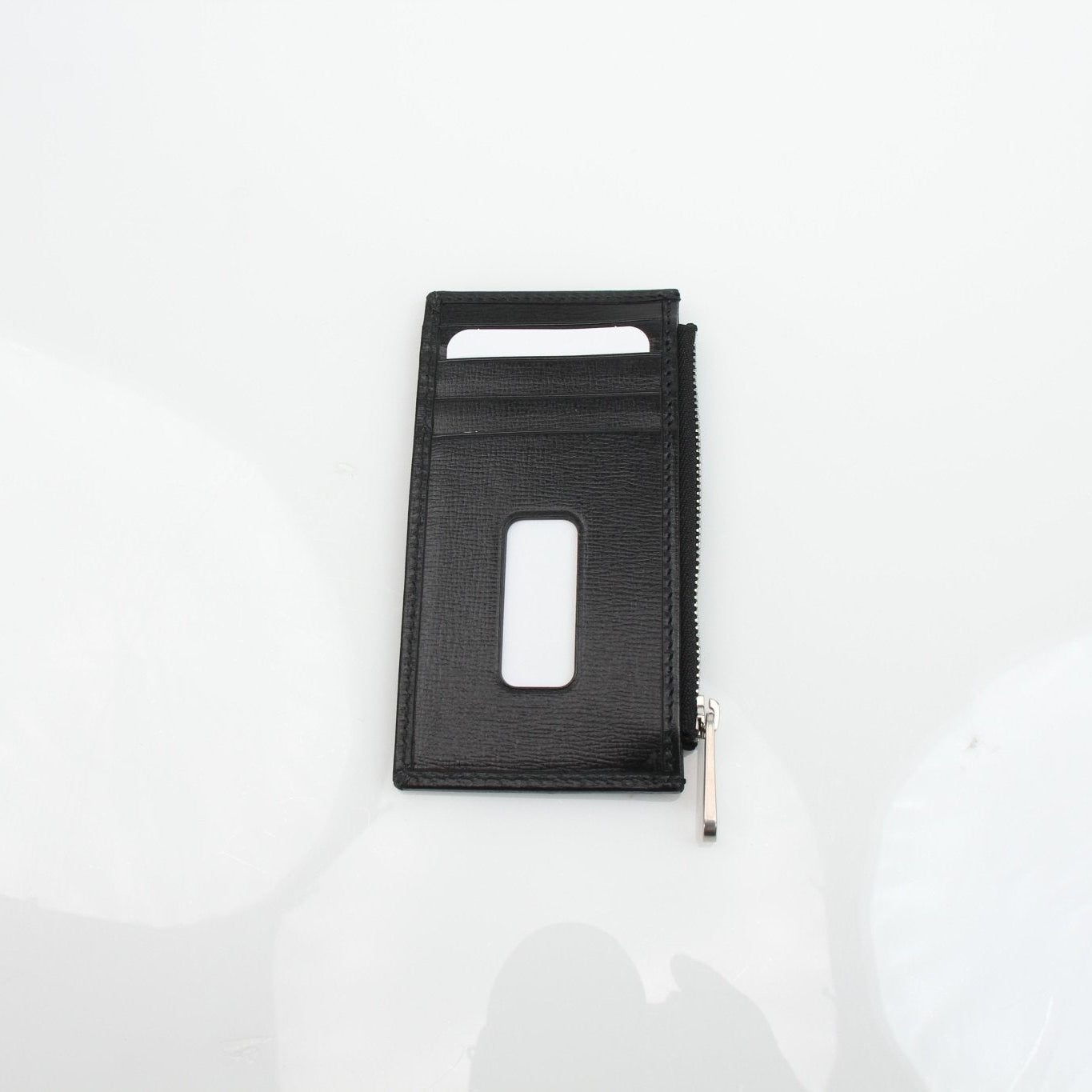 Gucci GG Supreme black wallet by Gold & Beyond, featuring a sleek design with iconic monogram pattern and multiple card slots.