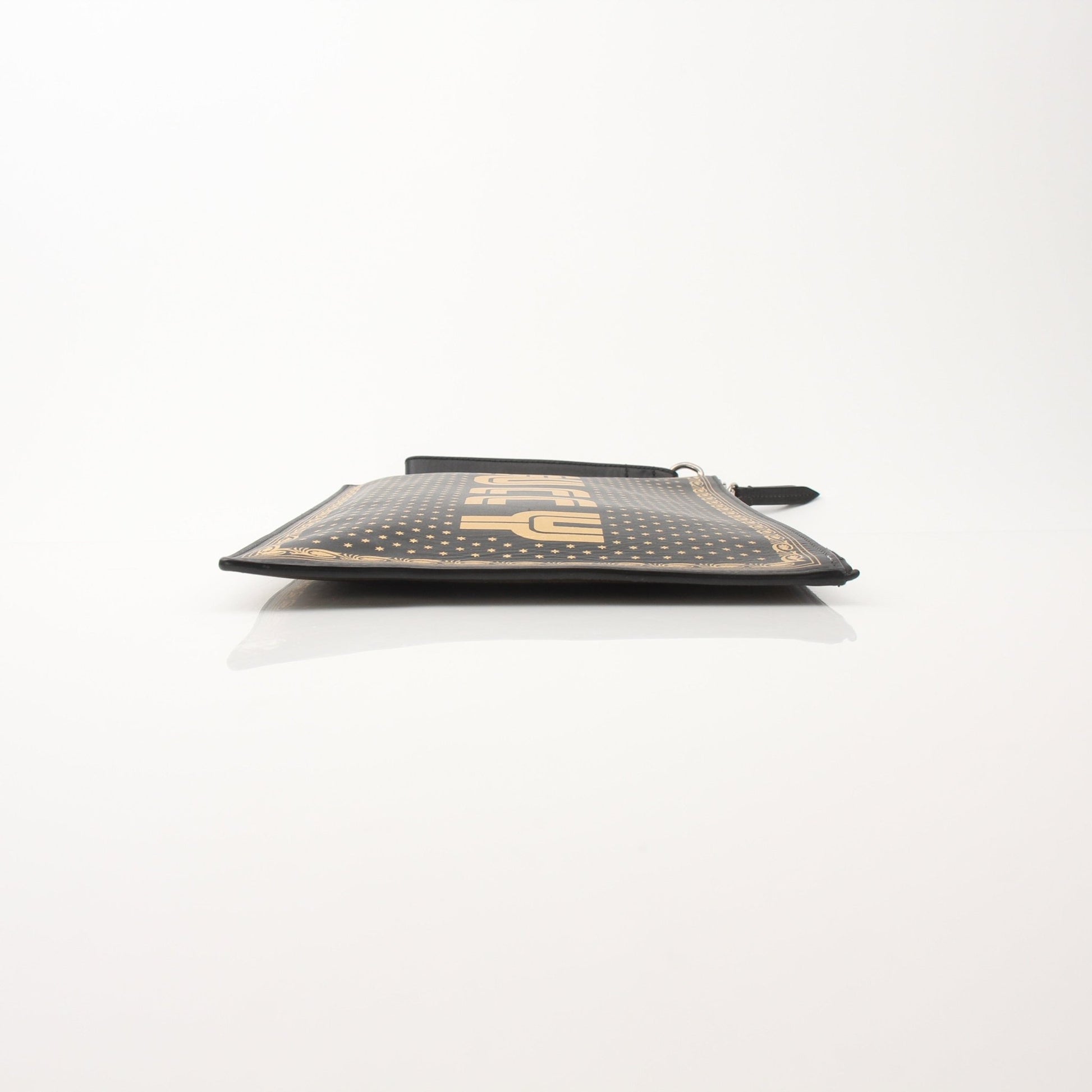 Gucci x SEGA black clutch handbag with gold accents, featuring a sleek design and playful Sega logo details.