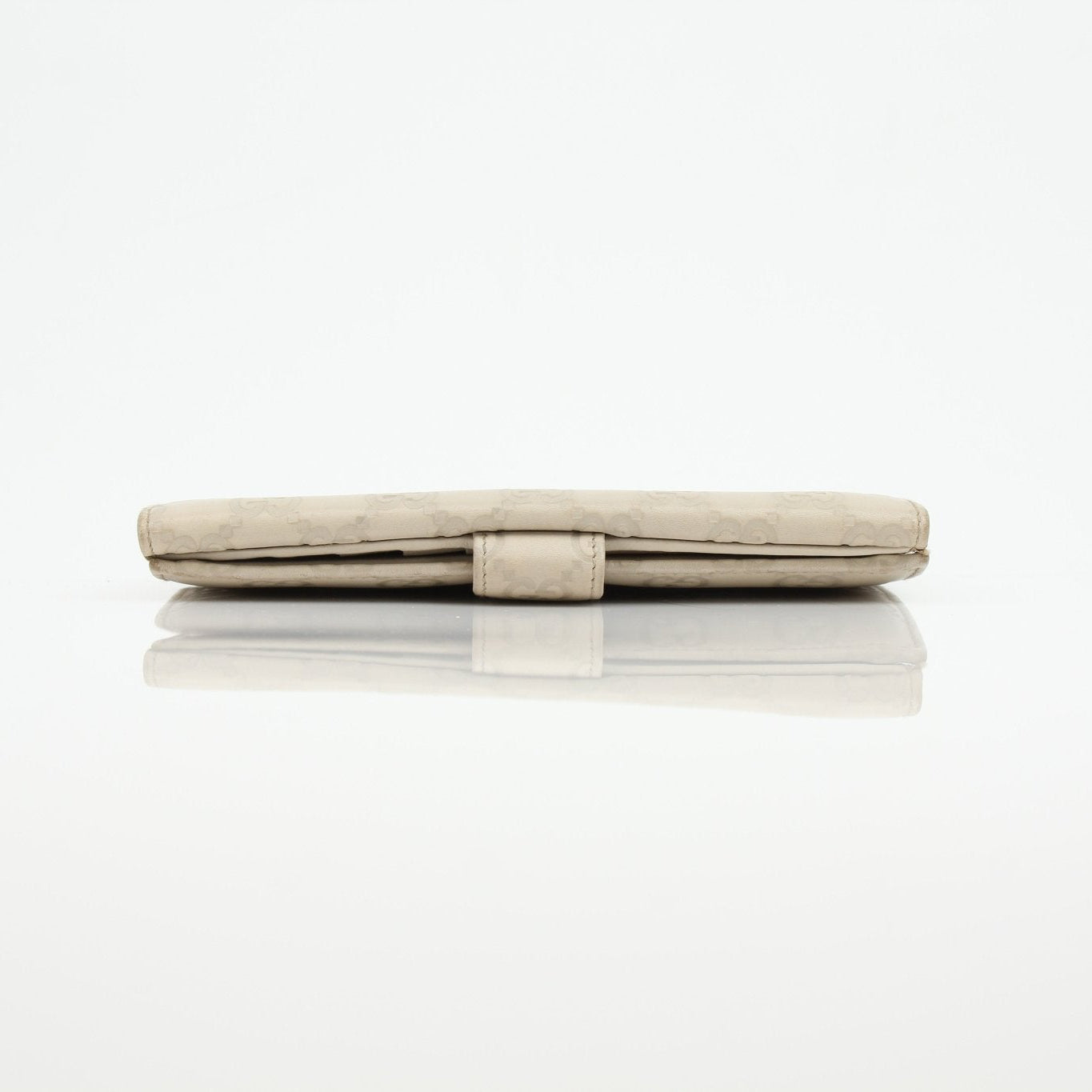 Gucci beige Guccissima wallet with gold accents, featuring signature monogram pattern and leather interior, by Gold & Beyond.