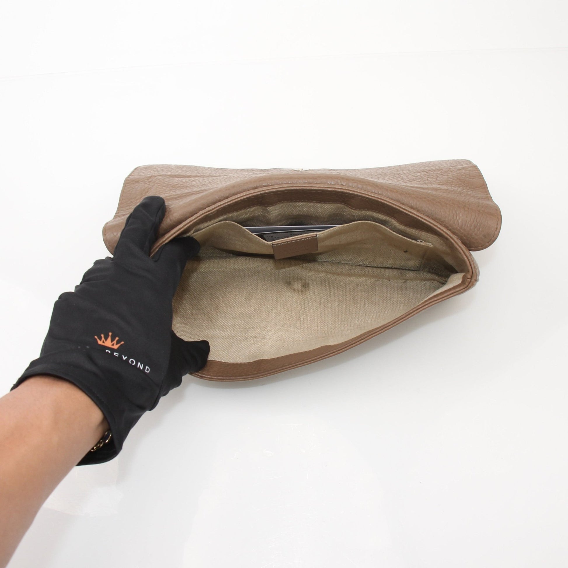 Gucci brown python Greenwich clutch handbag with gold accents, featuring a sleek, textured python leather design.