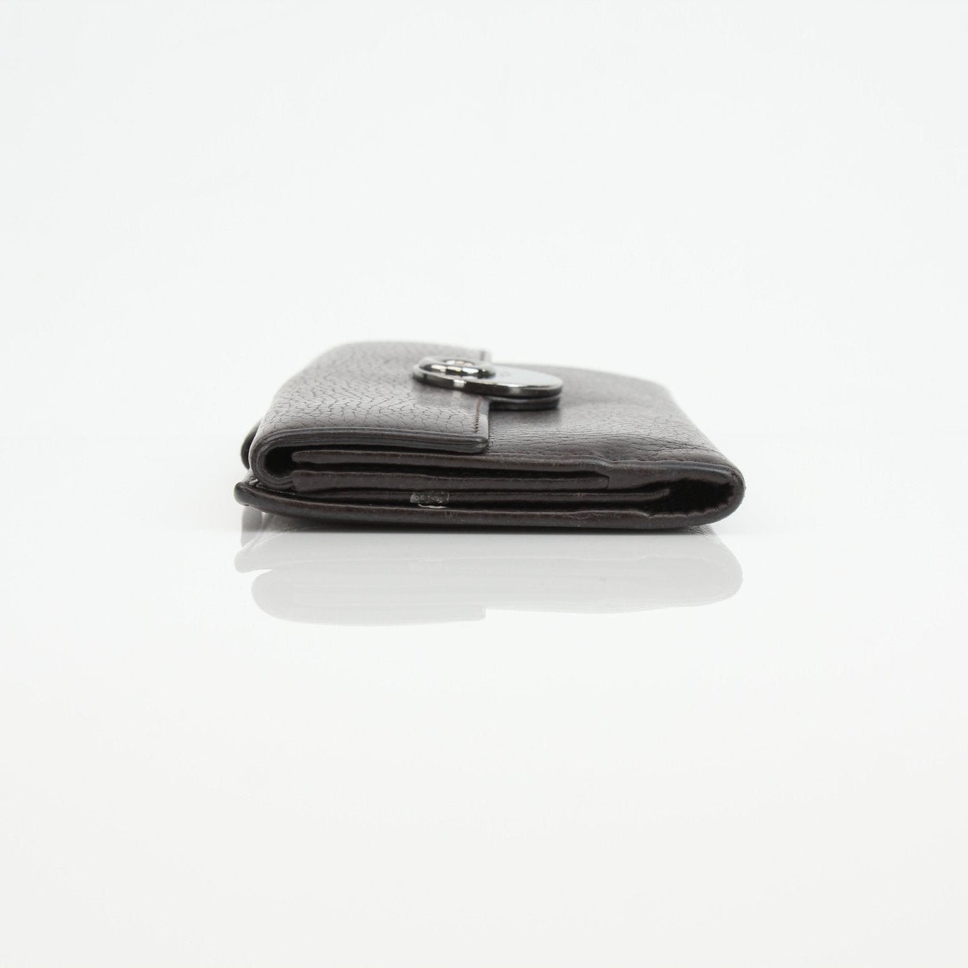 Gucci brown eclipse wallet with leather and gold accents, displayed open showing card slots and interior details.