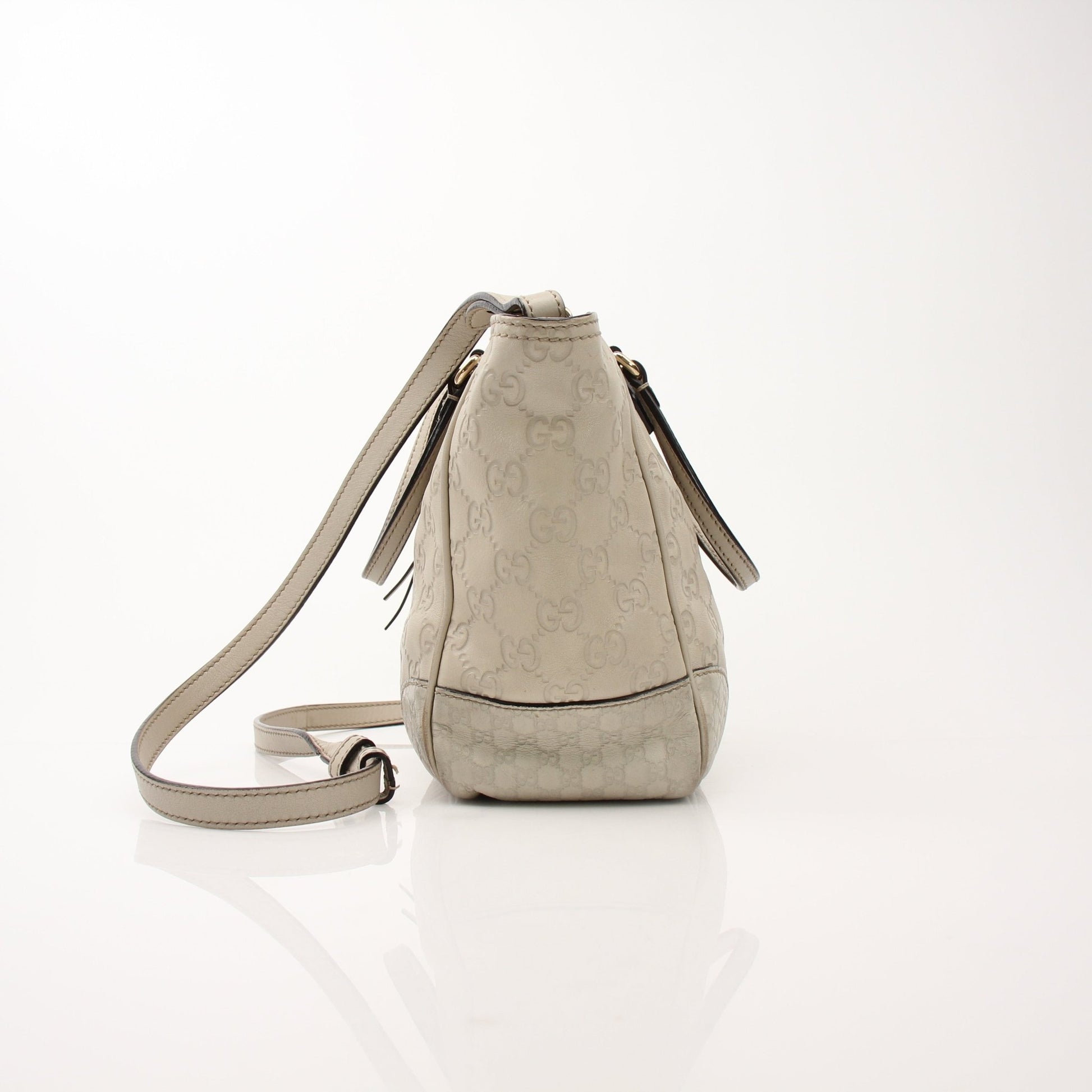 Gucci beige Bree tote handbag by Gold & Beyond, showcasing its stylish beige leather design with top handles and spacious interior.