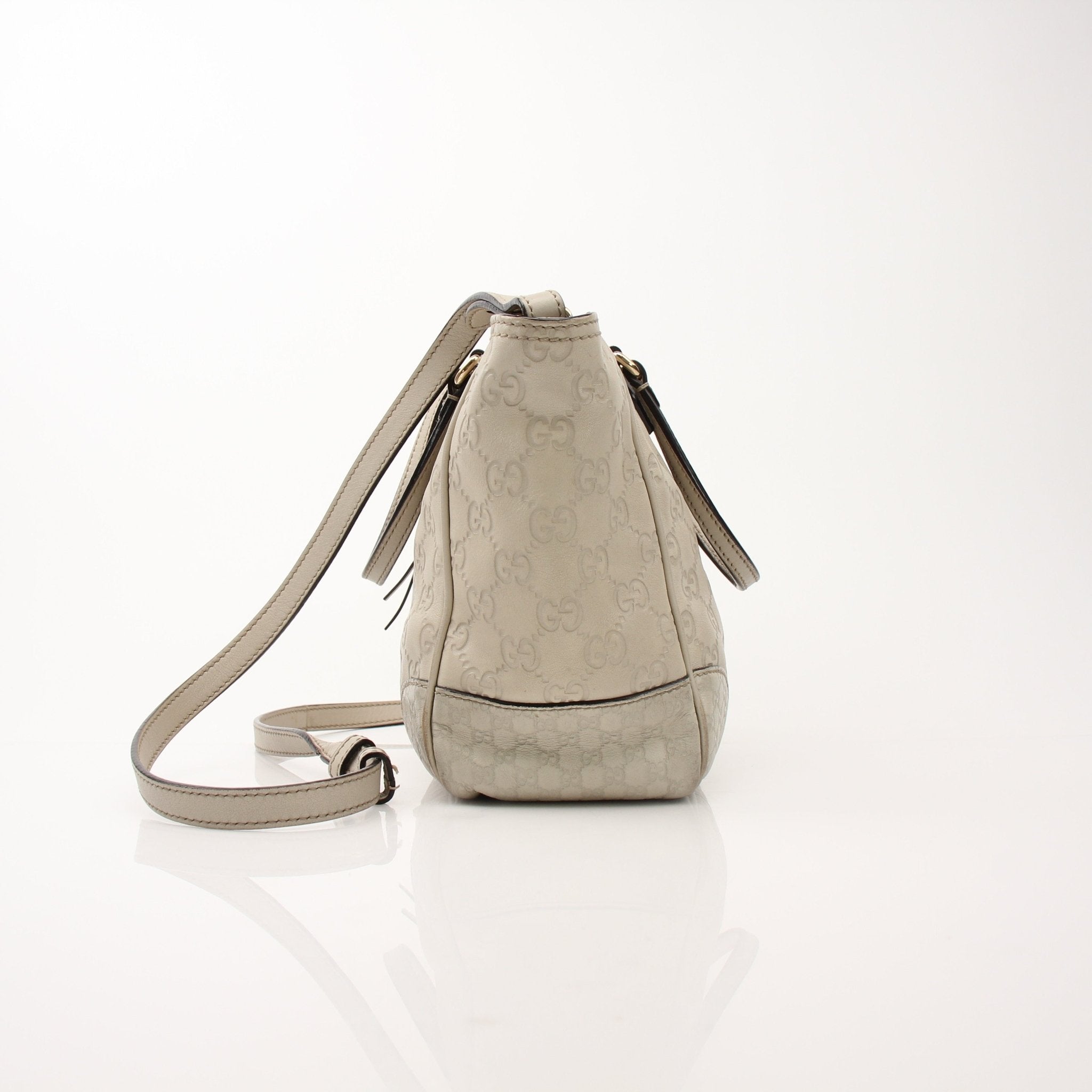 Gucci beige Bree tote handbag by Gold & Beyond, showcasing its stylish beige leather design with top handles and spacious interior.