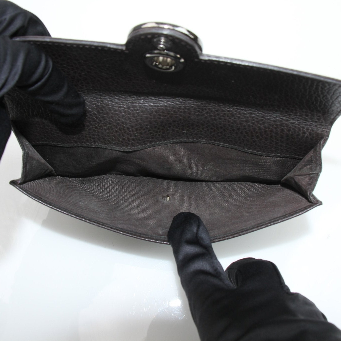 Gucci brown eclipse wallet with gold accents, featuring multiple card slots and a sleek leather design.