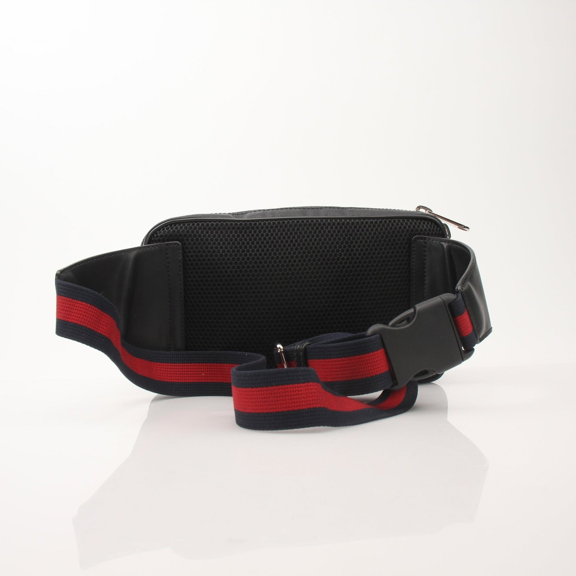 Gucci GG Supreme monogram web belt bag with adjustable strap, featuring gold-tone hardware and signature design details.