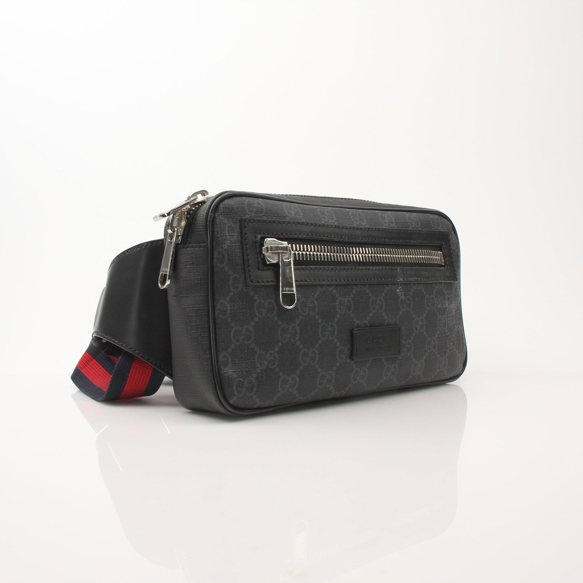 Gucci GG Supreme monogram web belt bag with adjustable strap and gold-tone hardware, stylish handbag for casual or chic looks.