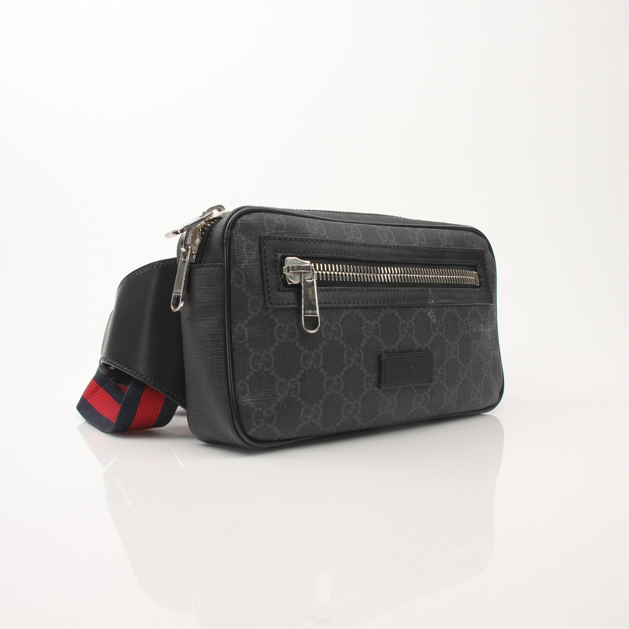 Gucci GG Supreme monogram web belt bag with adjustable strap and gold-tone hardware, stylish handbag for casual or chic looks.
