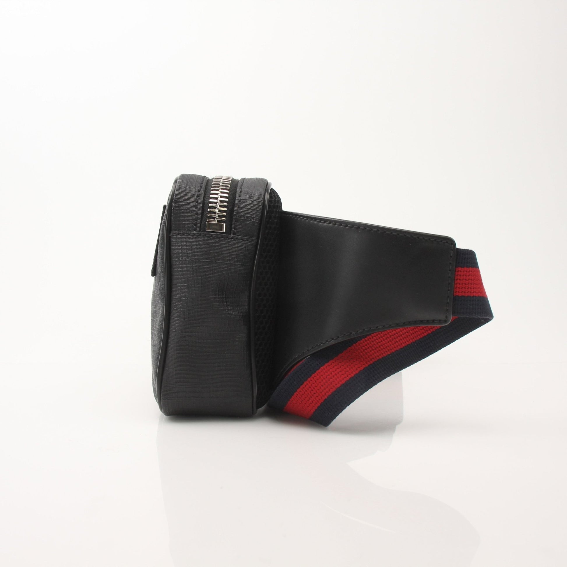 Gucci GG Supreme monogram web belt bag with adjustable strap and gold-tone hardware, featuring signature monogram pattern.