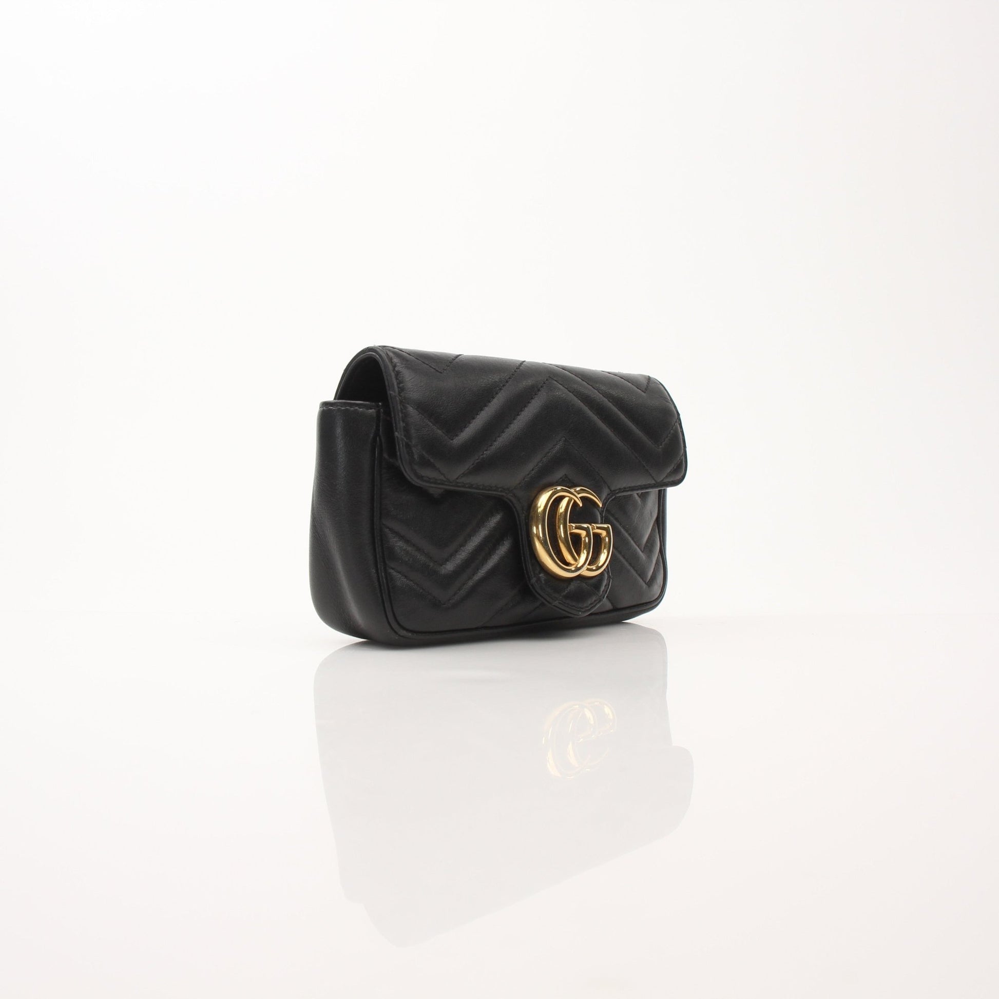 Gold & Beyond Gucci Calfskin Matelassé GG Marmont mini shoulder handbag with quilted design and gold-tone hardware.