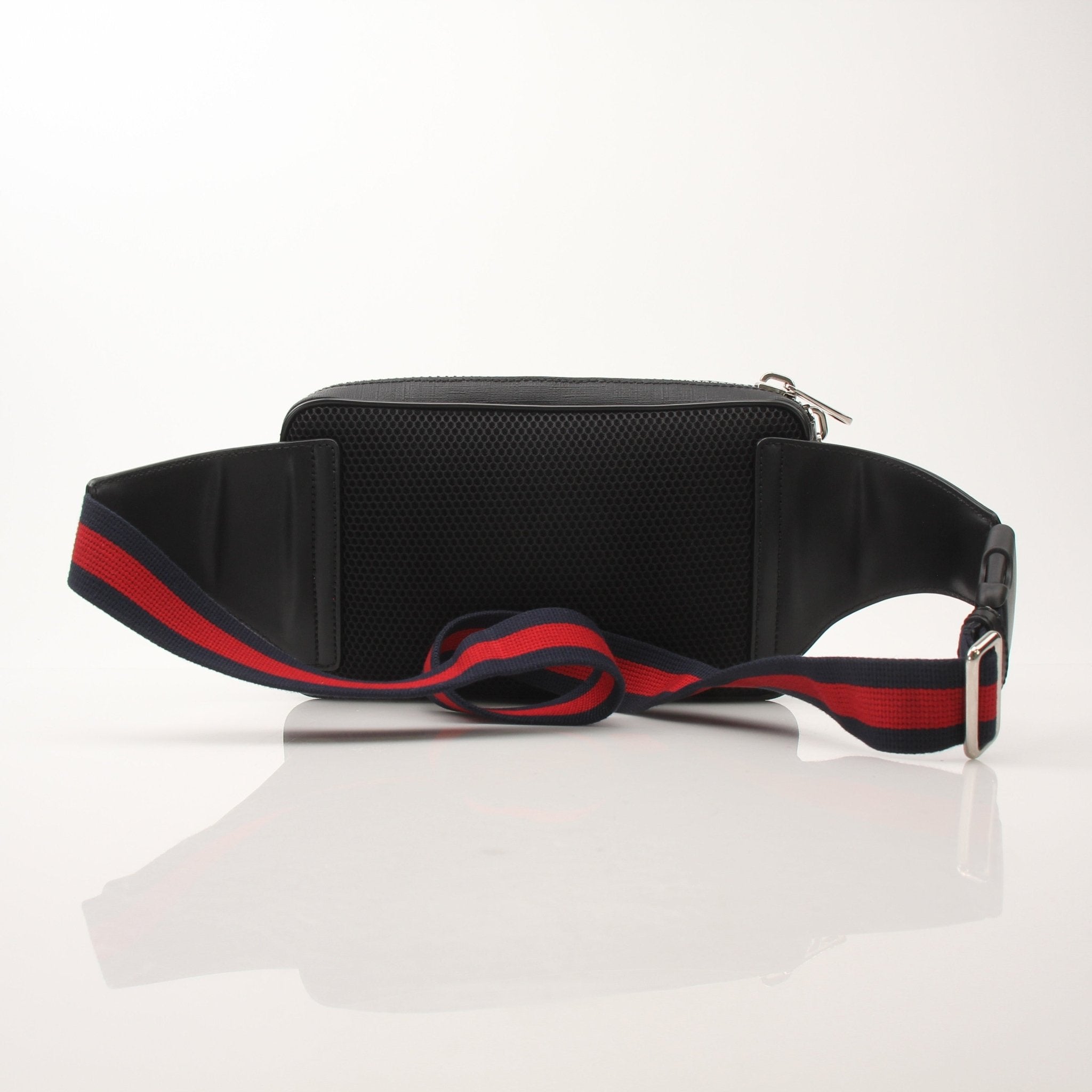 Gold & Beyond Gucci Web Belt Bag handbag with adjustable strap, featuring signature web design and gold-tone hardware.