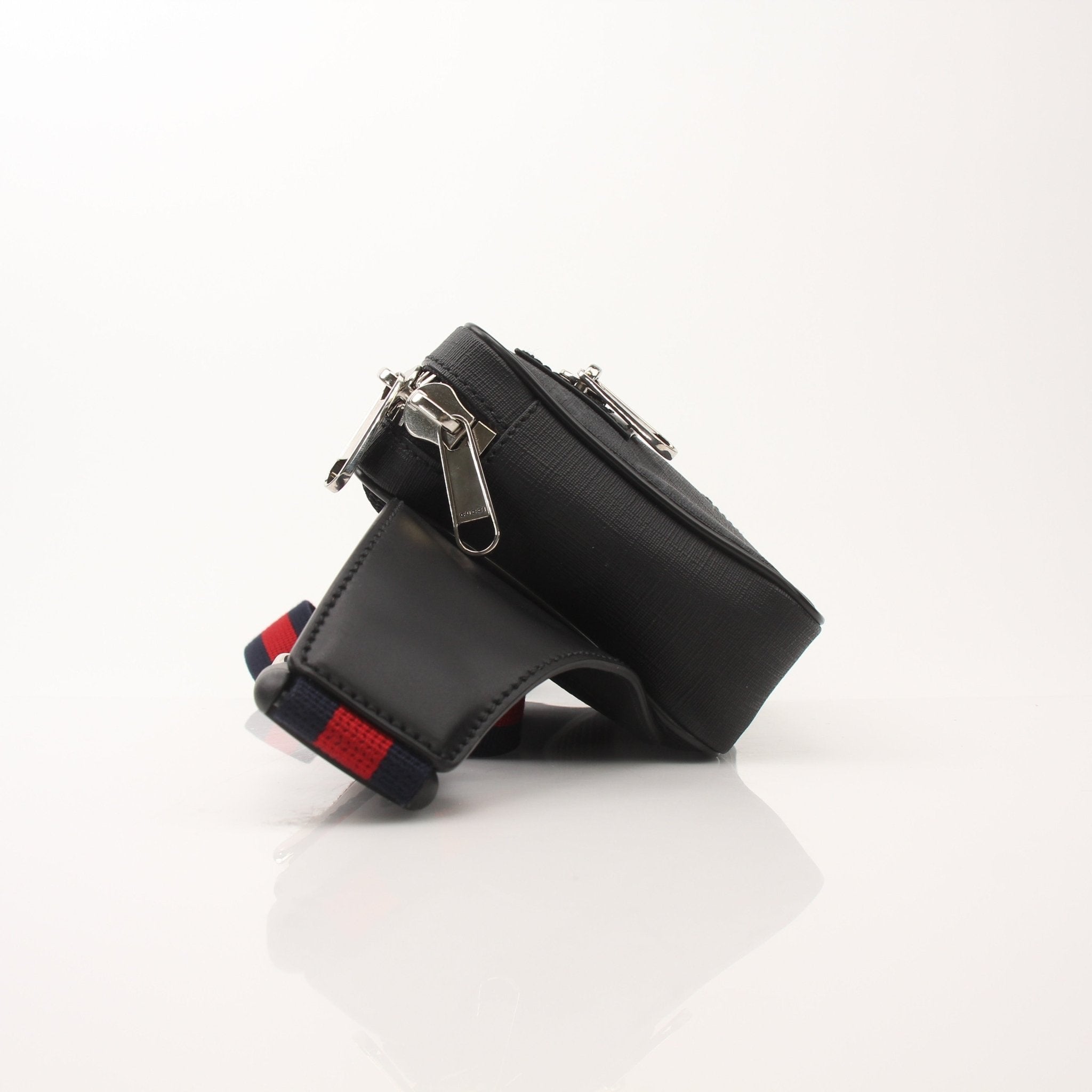 Gold & Beyond Gucci Web Belt Bag handbag with adjustable strap, featuring signature web design and gold accents.