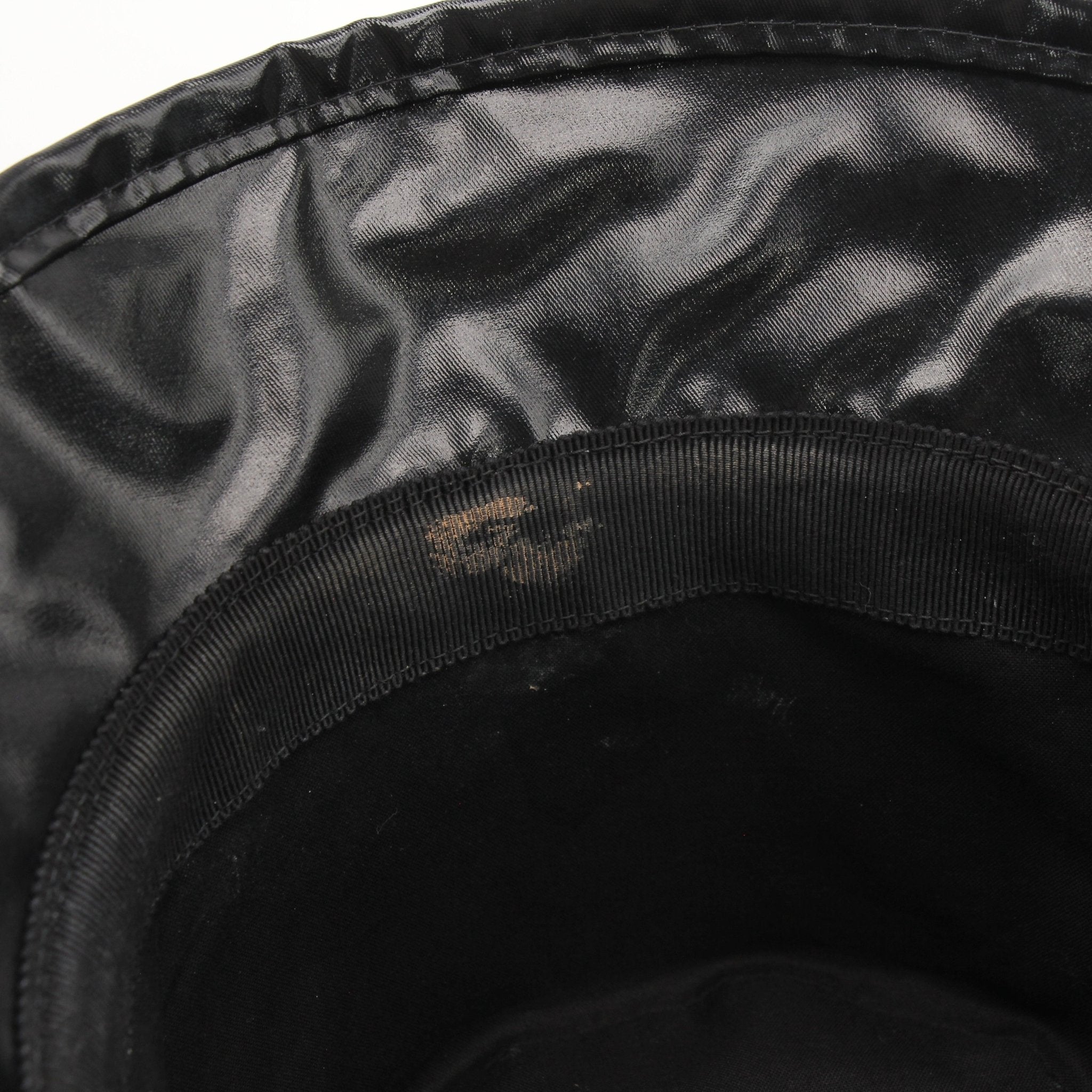 Gucci Coated Canvas Monte Carlo Bucket Hat in beige with Gucci logo, stylish accessory for sun protection and fashion.
