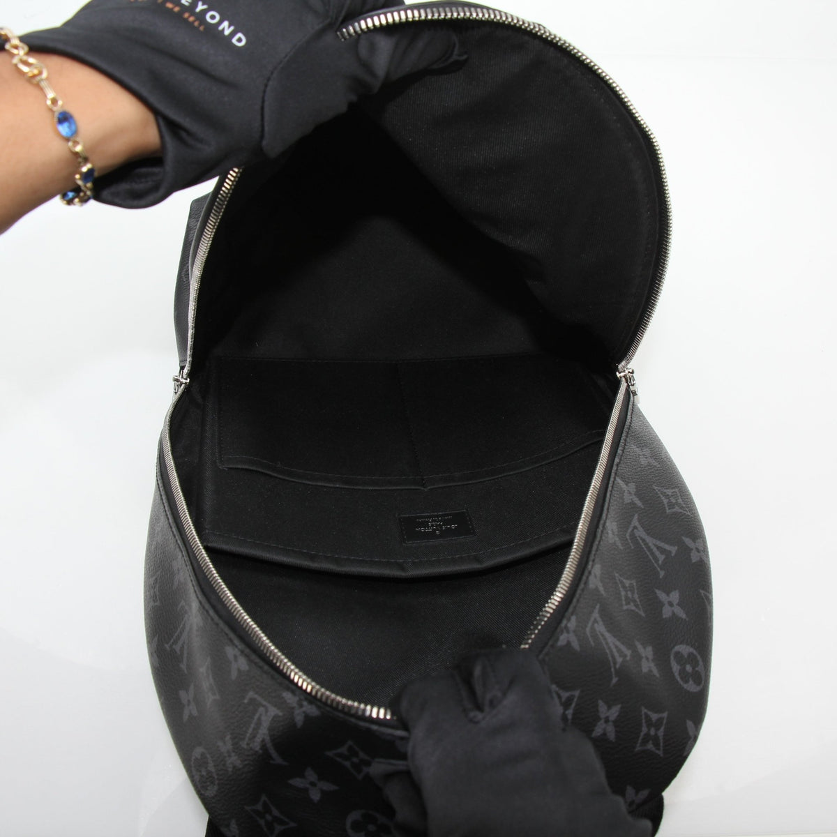 Louis Vuitton Black Monogram Eclipse Discovery Backpack PM, a stylish travel bag with sleek design and adjustable straps.